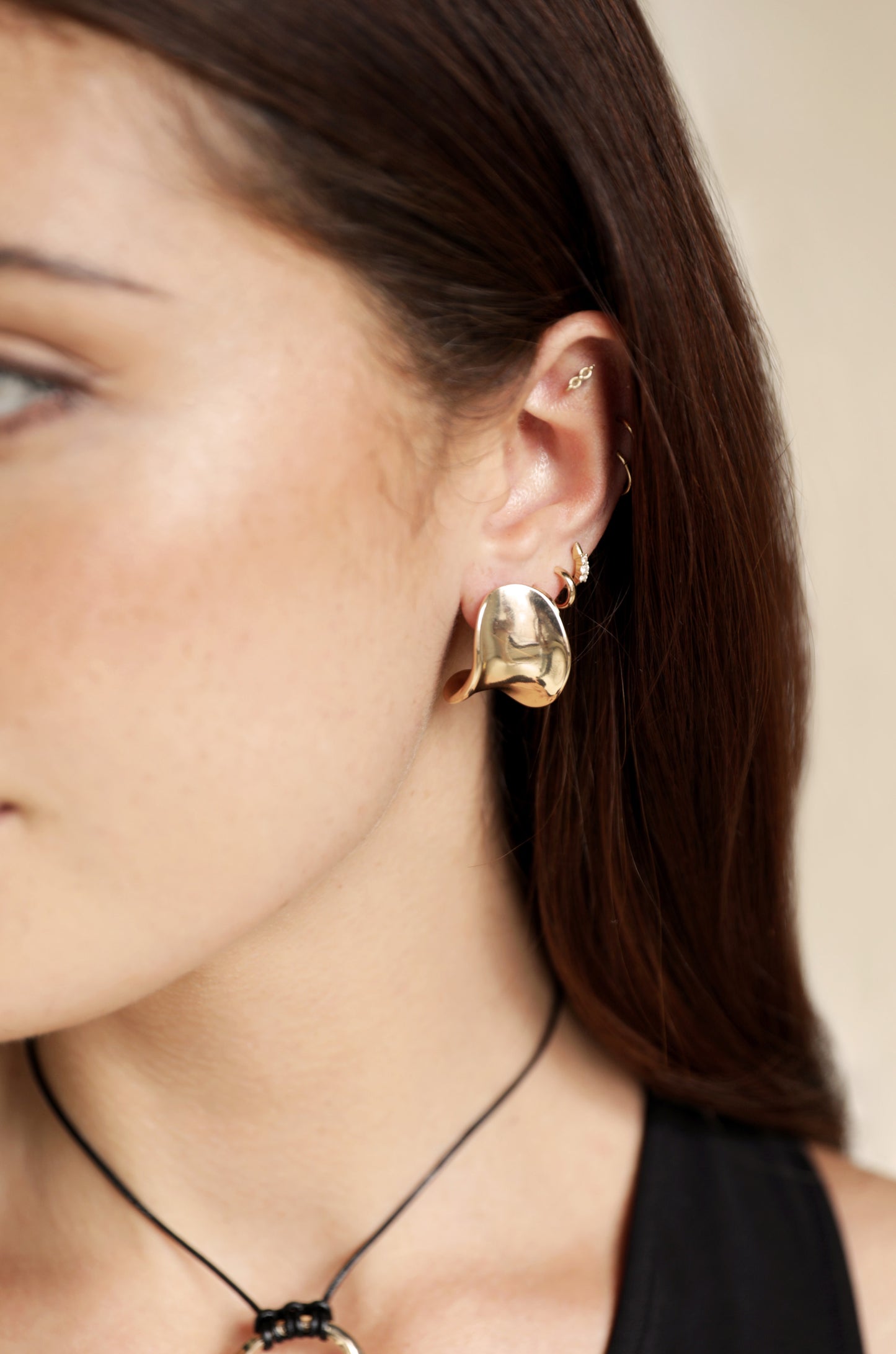 Curved Stud Earrings on model