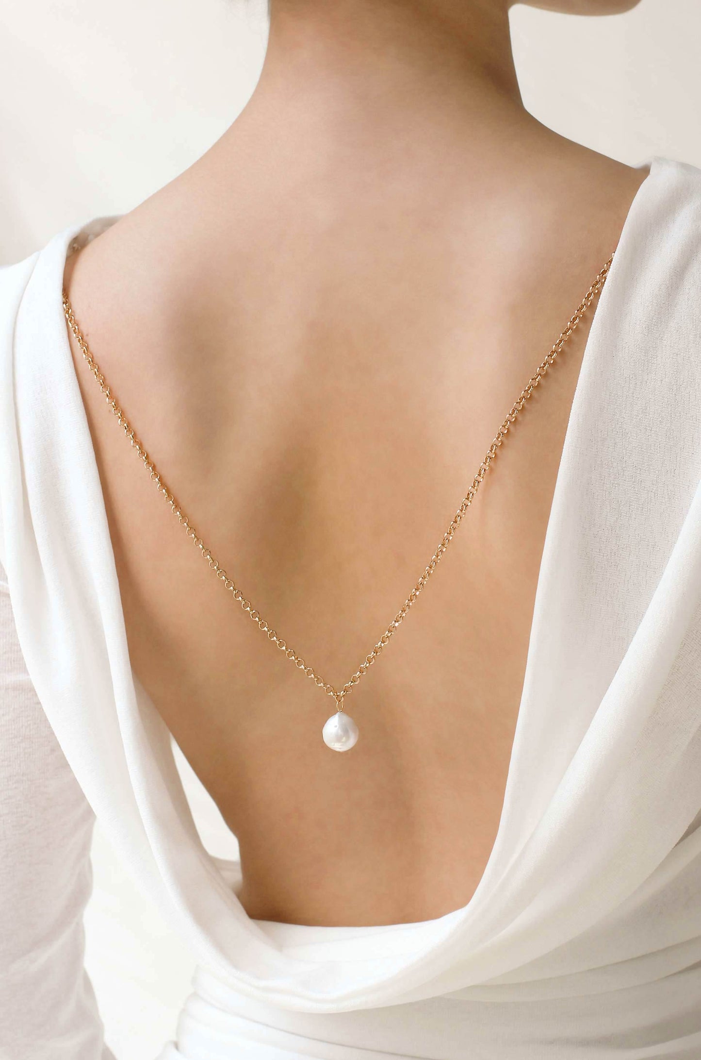 Single Pearl Drop Back Body Chain on model