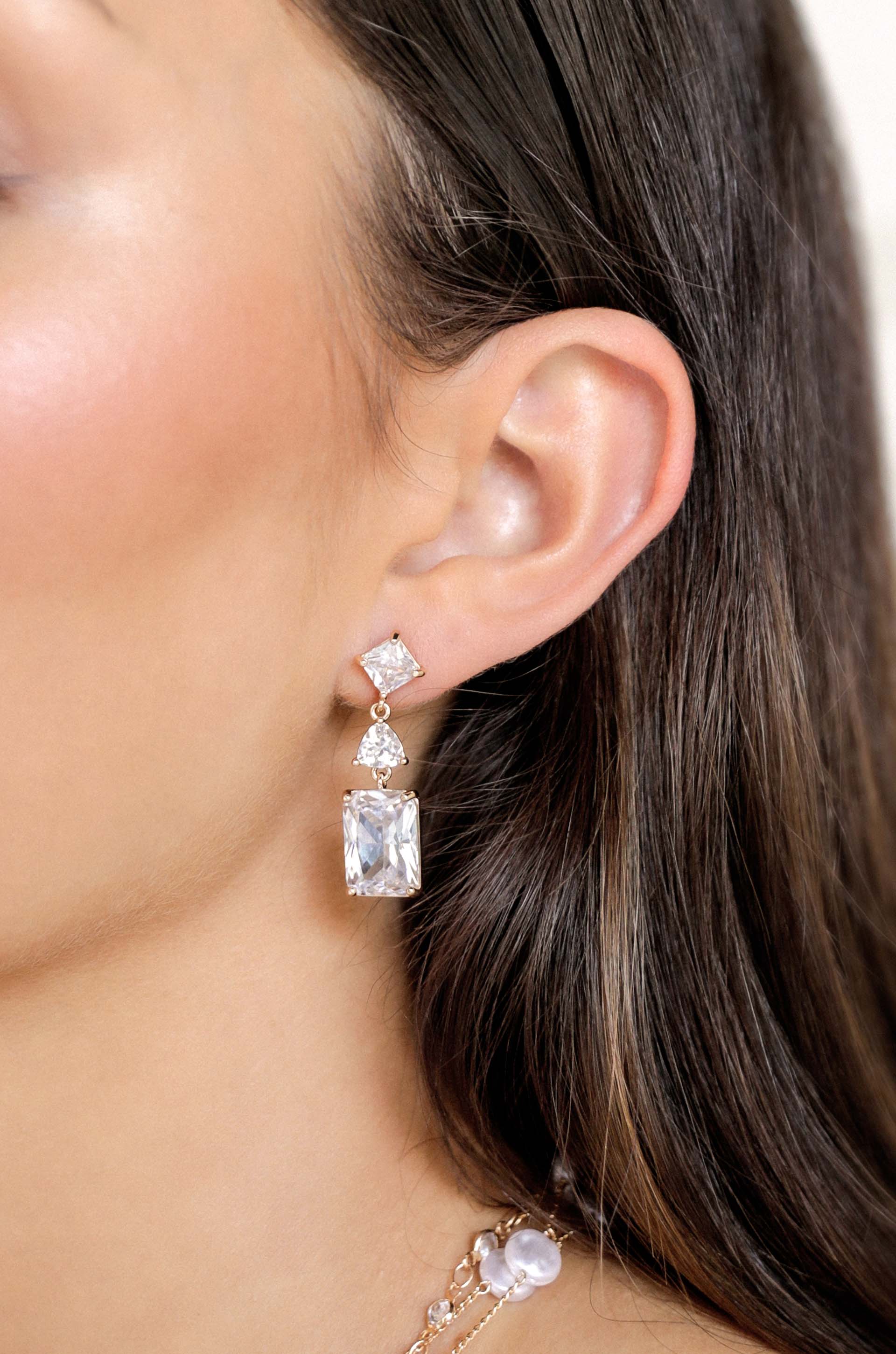 Reflective Crystal Dangle Earrings on model 2