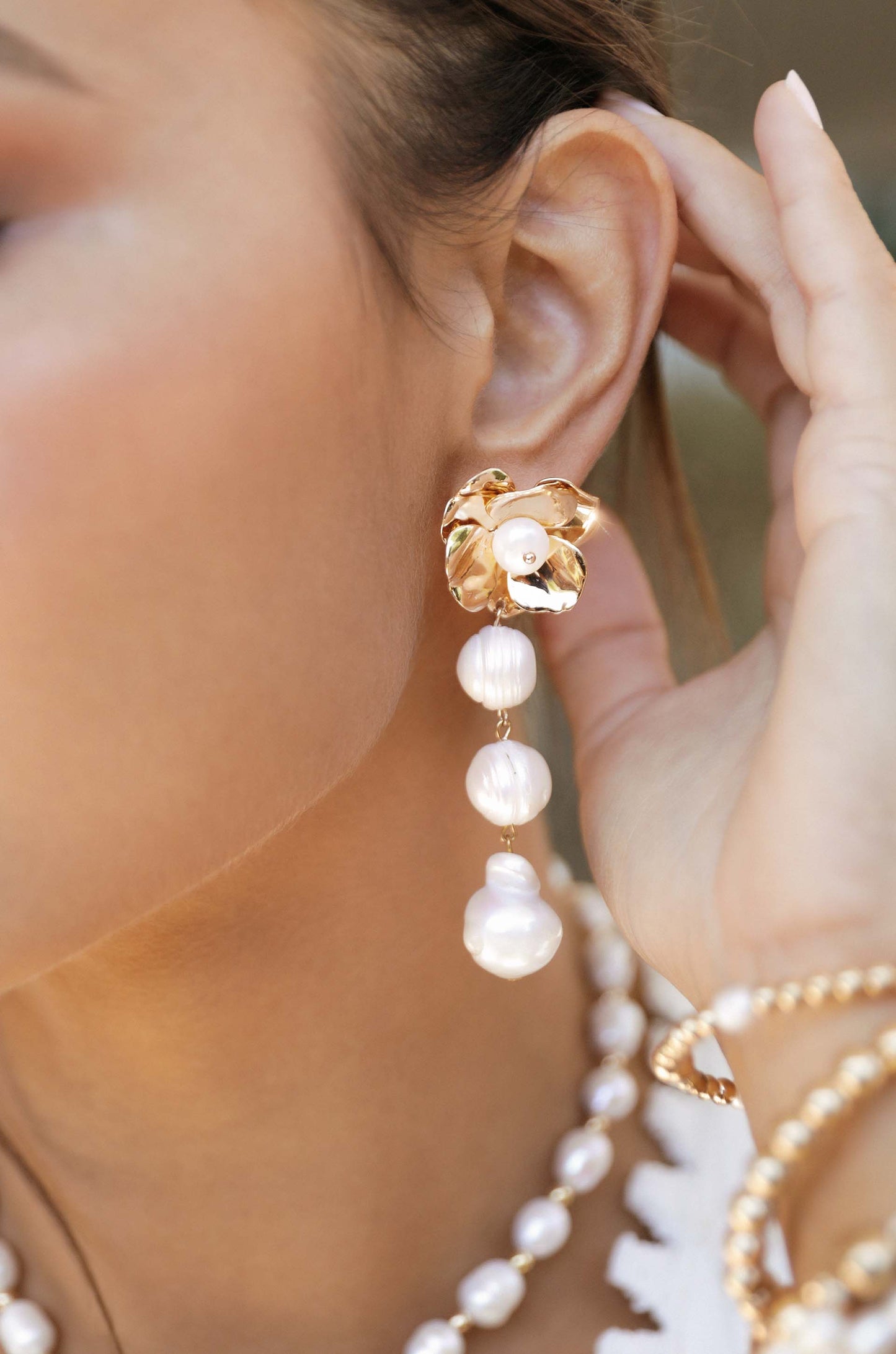 Golden Petals and Graduating Freshwater Pearl Earrings on model