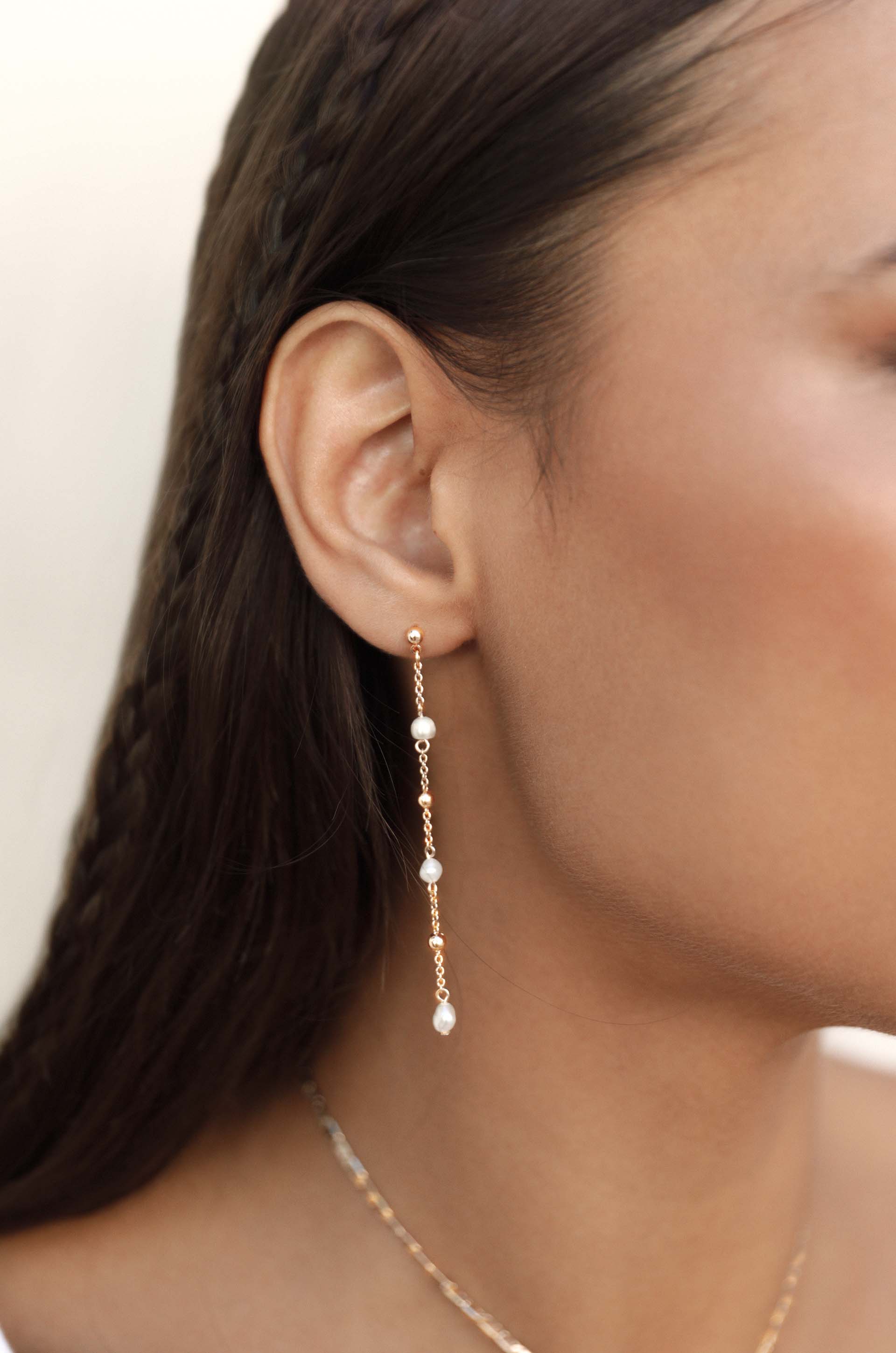 Double Piercing Freshwater Pearl Earrings on model 2