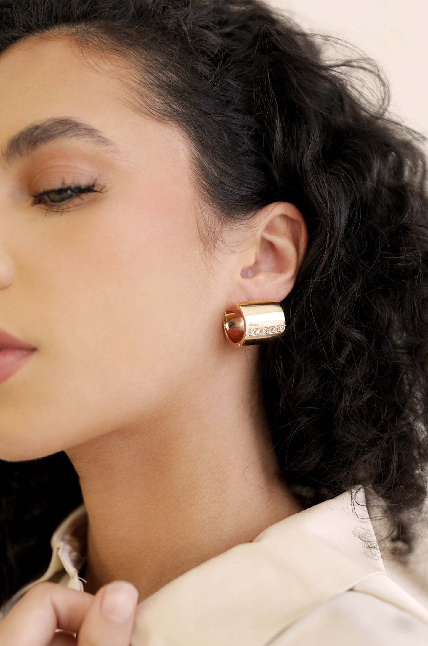 Rolled Up Stud Earrings on model 2