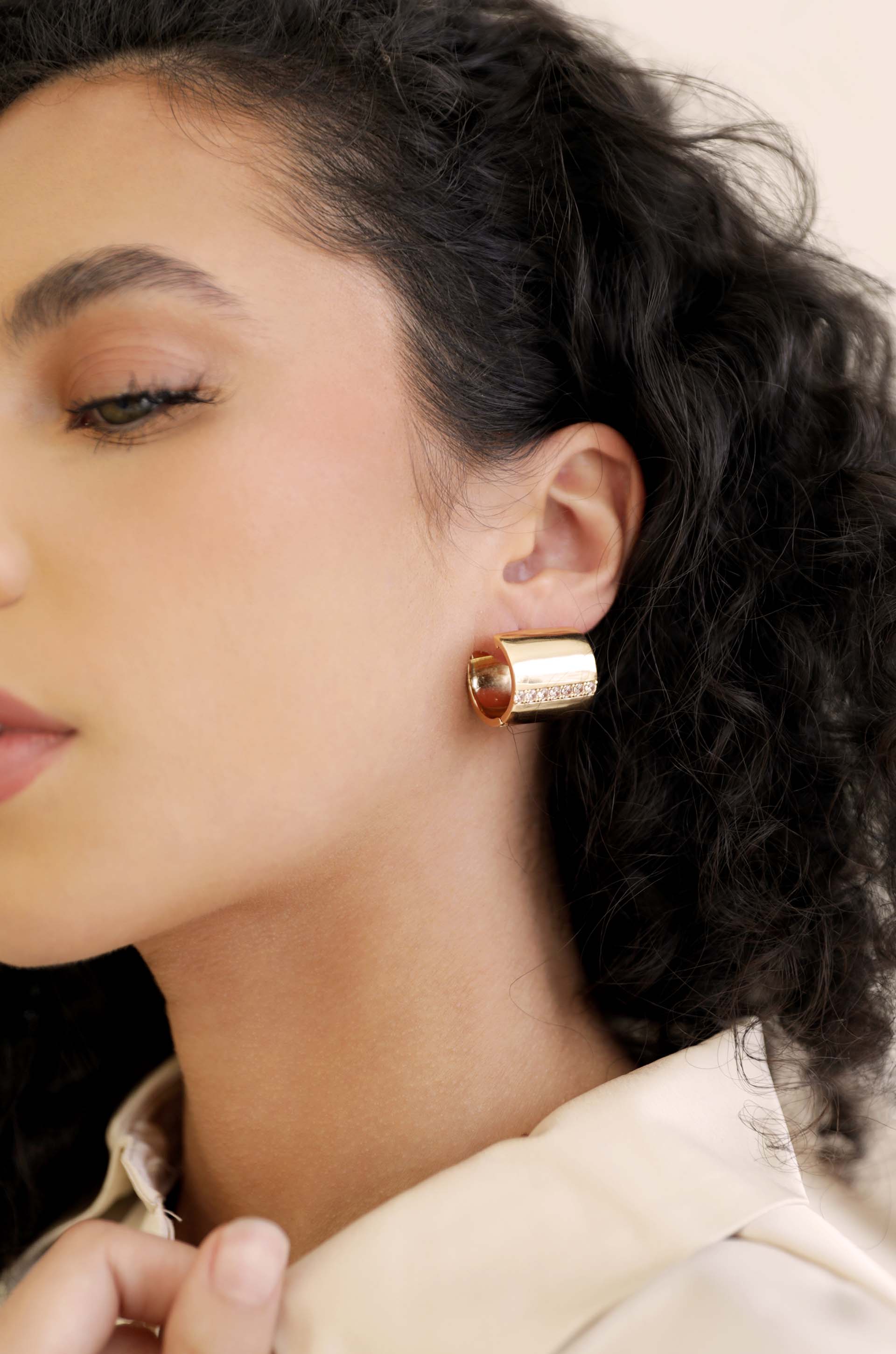 Rolled Up Stud Earrings on model 2