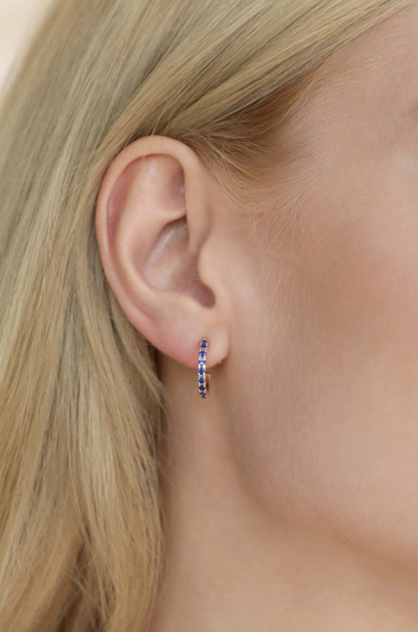 Colorful Crystal 18k Gold Plated Huggie Earrings in sapphire on model