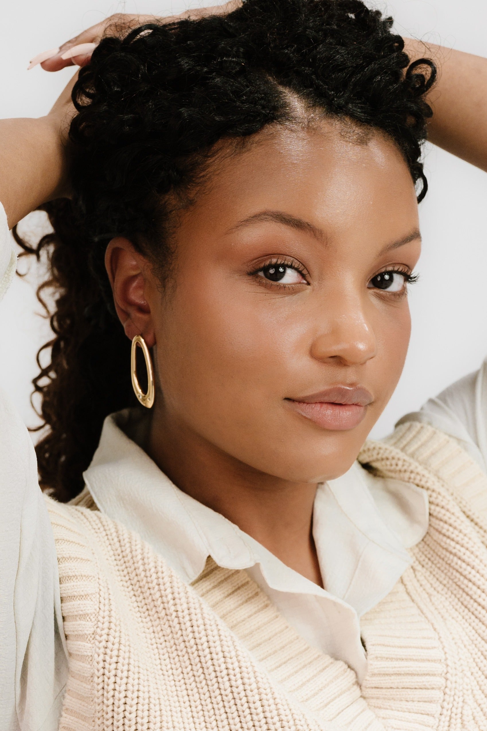 Molten Crystal Dotted Oval Earrings on model 4