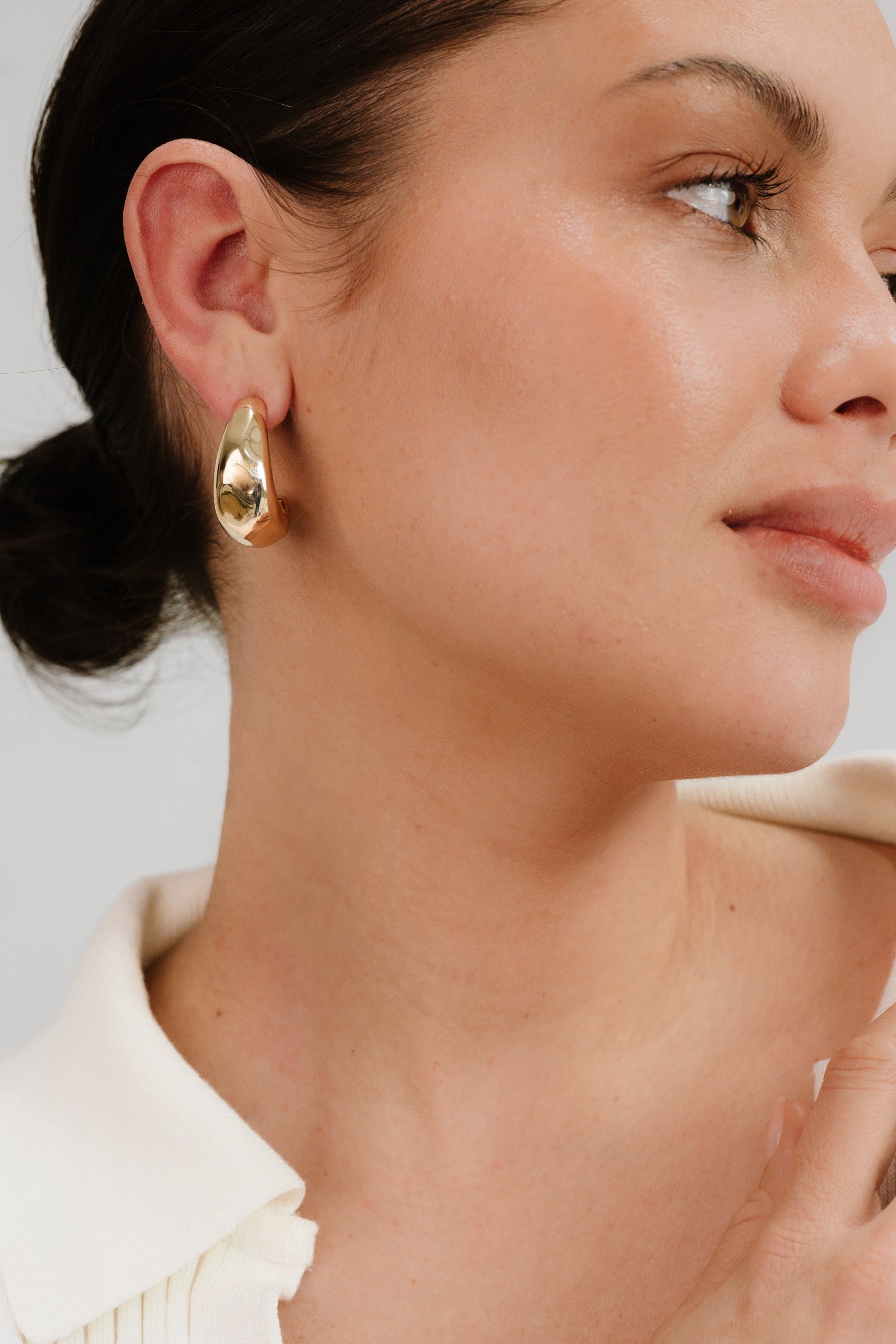 True Golden Hoop Earrings on model 4