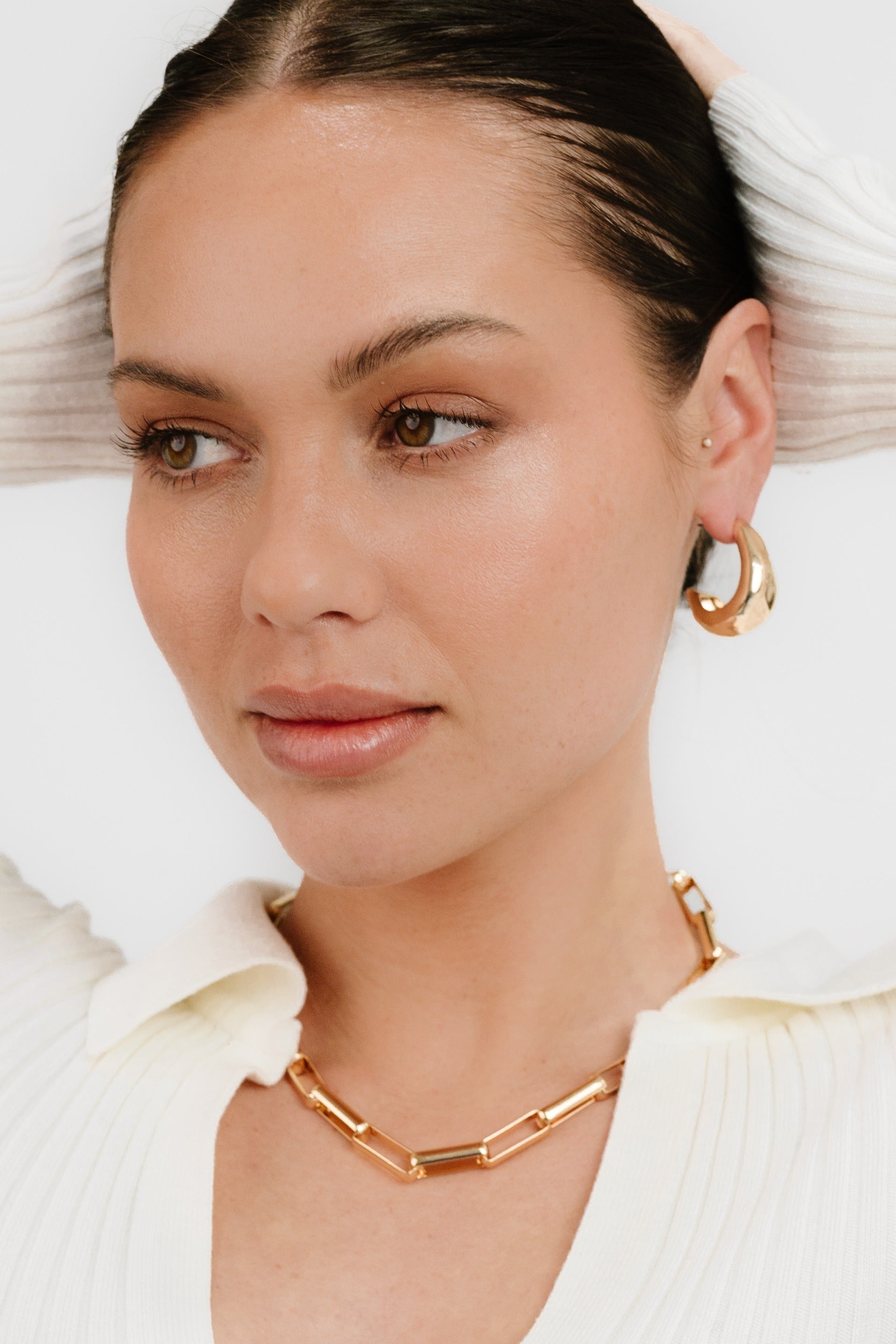 True Golden Hoop Earrings on model 2