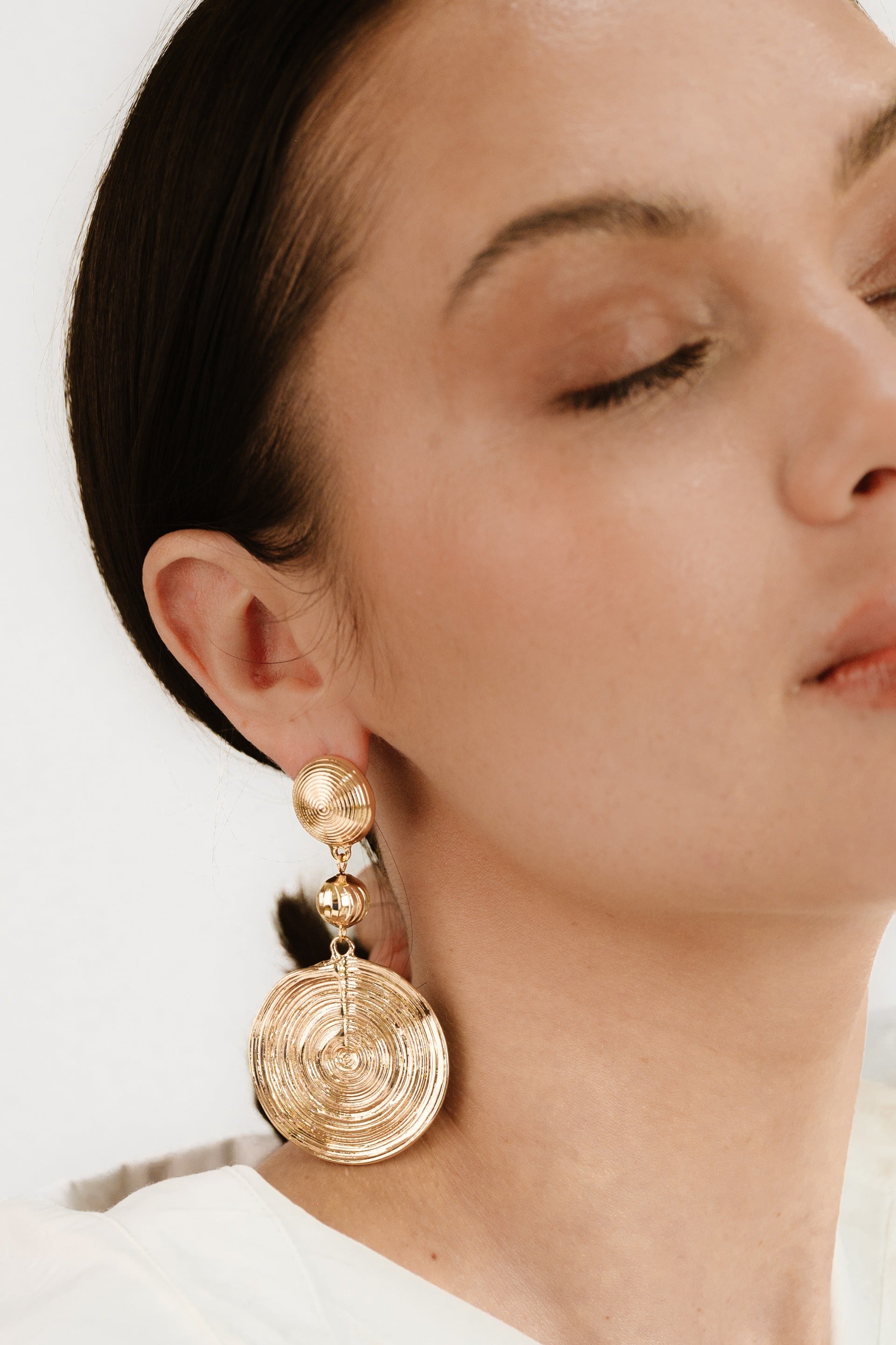 Textured Disc 18k Gold Plated Statement Earrings on model 2