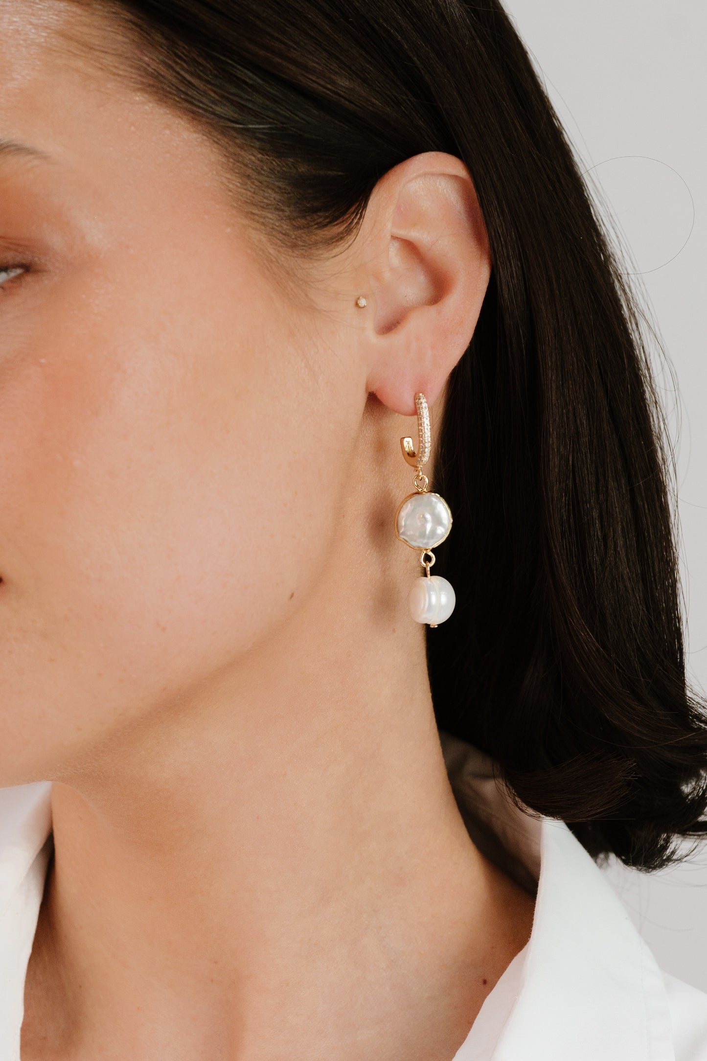 Dangling Freshwater Pearl Huggie Hoop Earrings on model 3