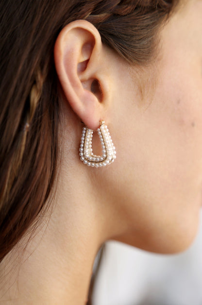 Soft Curve Pearl Lined Hoop Earrings on model 3