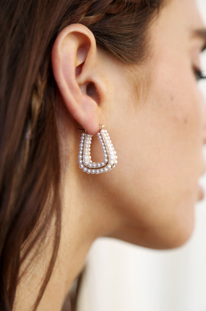 Soft Curve Pearl Lined Hoop Earrings on model 