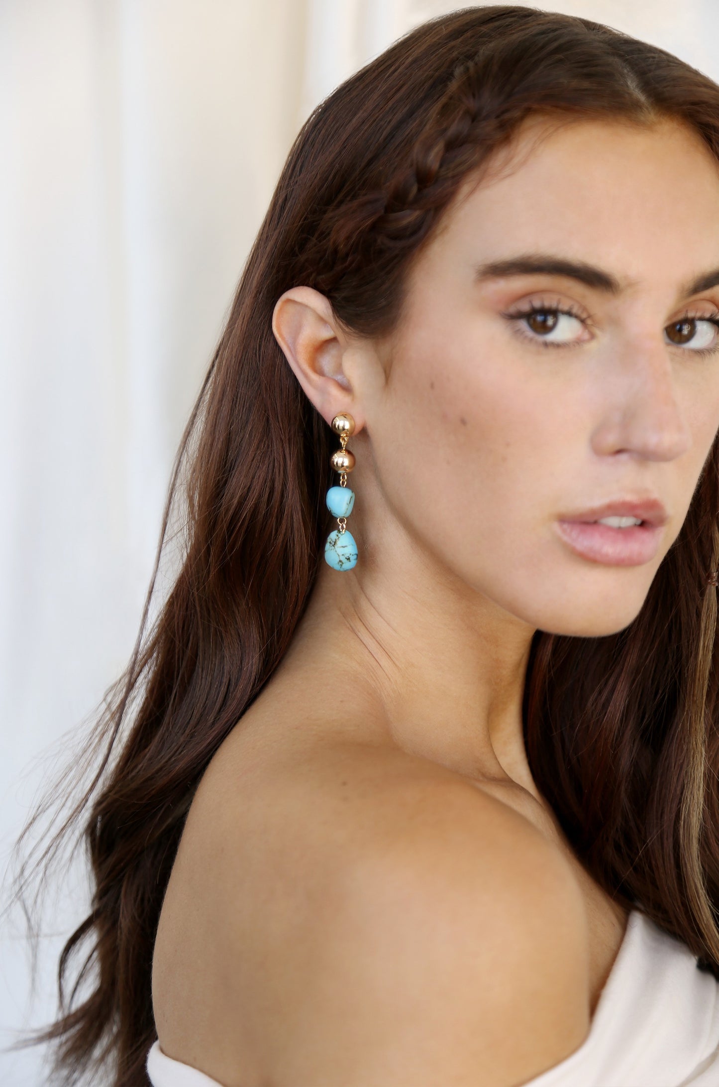Resort Drop Earrings in turquoise on model 2