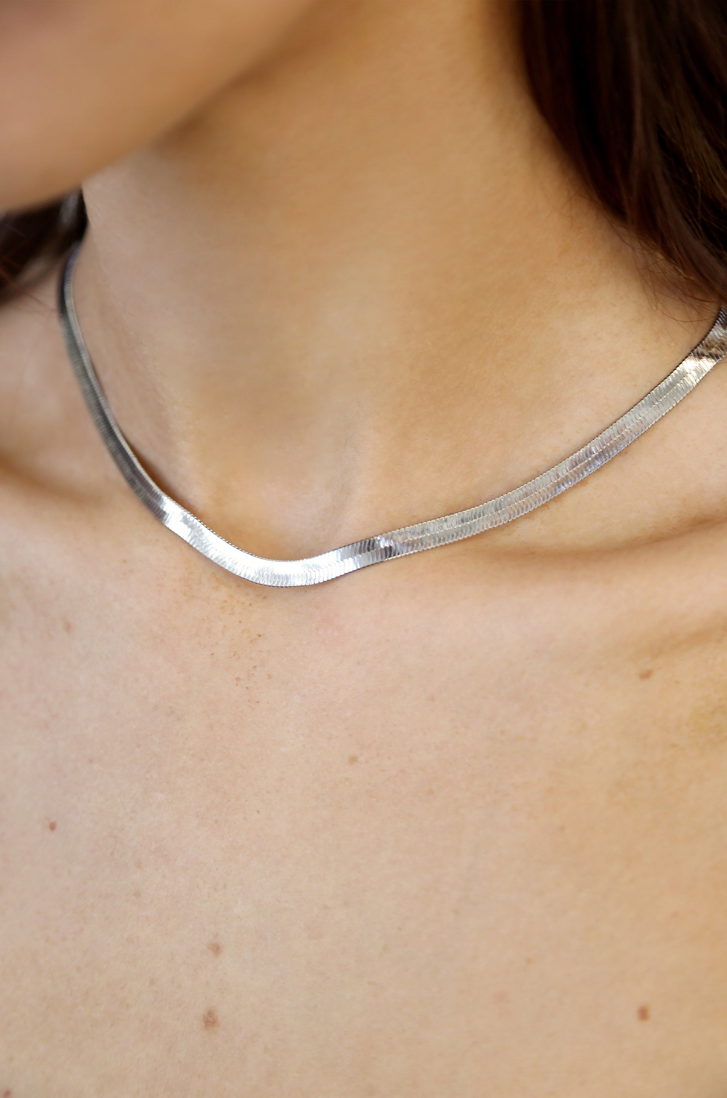 Brooklyn Flat Herringbone Chain Necklace in rhodium on model 2