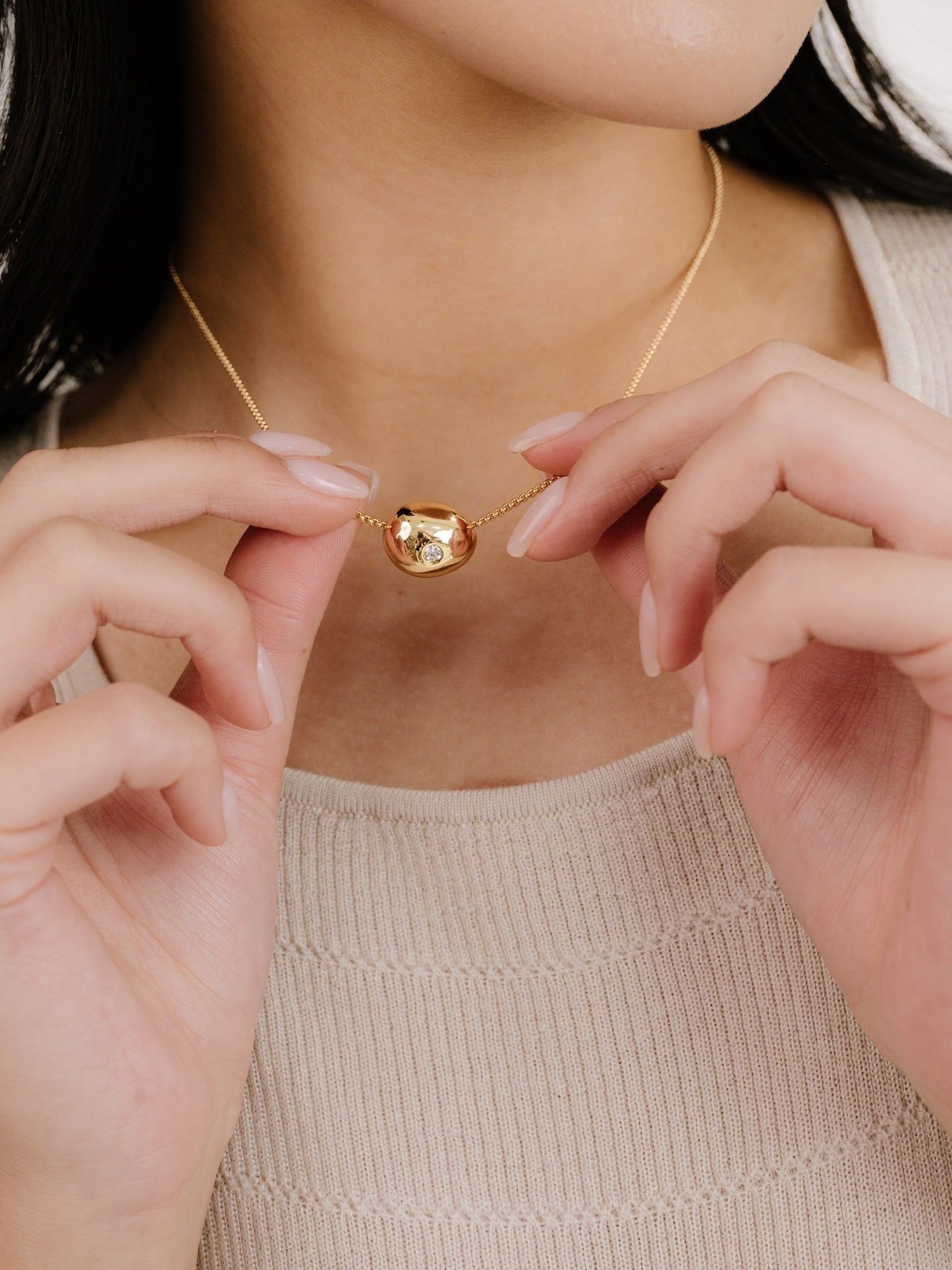 Crystal Dot Pebble Pendant Necklace on model 2