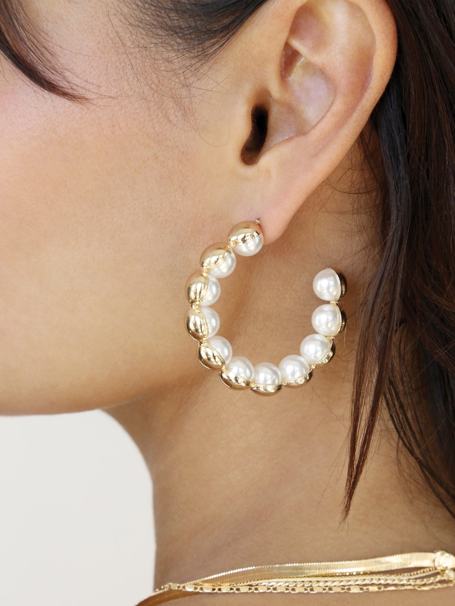 Pearl Inlay and Gold Hoop Earrings on model 2