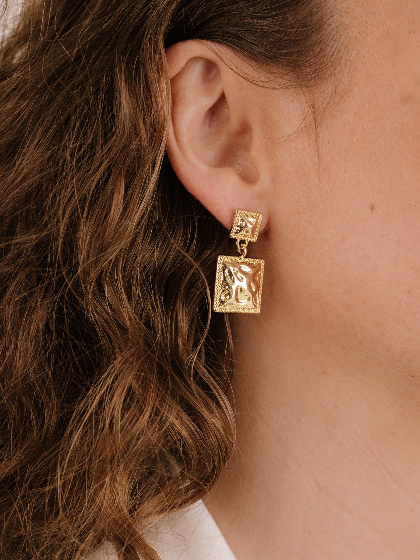 Repeated Square Dangle Earrings on model