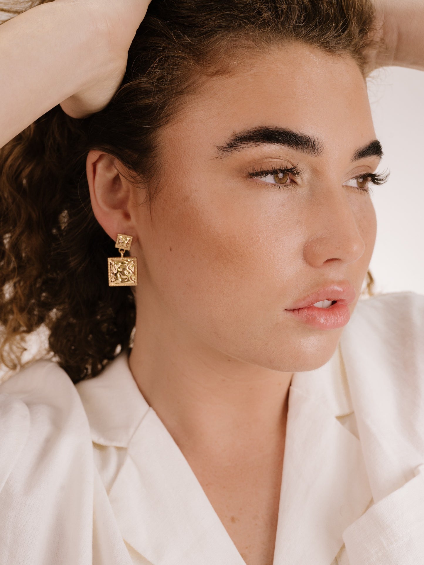 Repeated Square Dangle Earrings on model 2