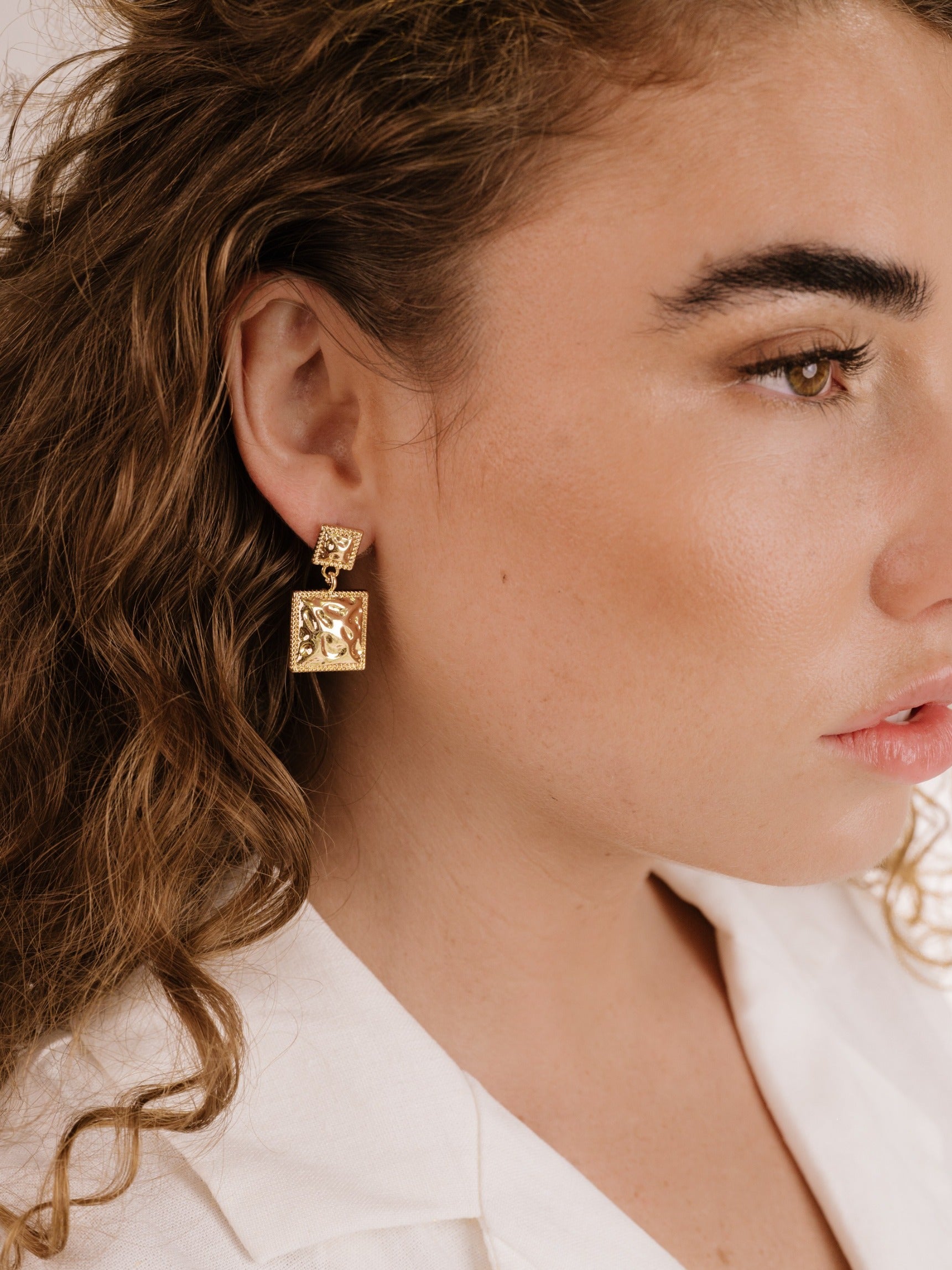 Repeated Square Dangle Earrings on model 3