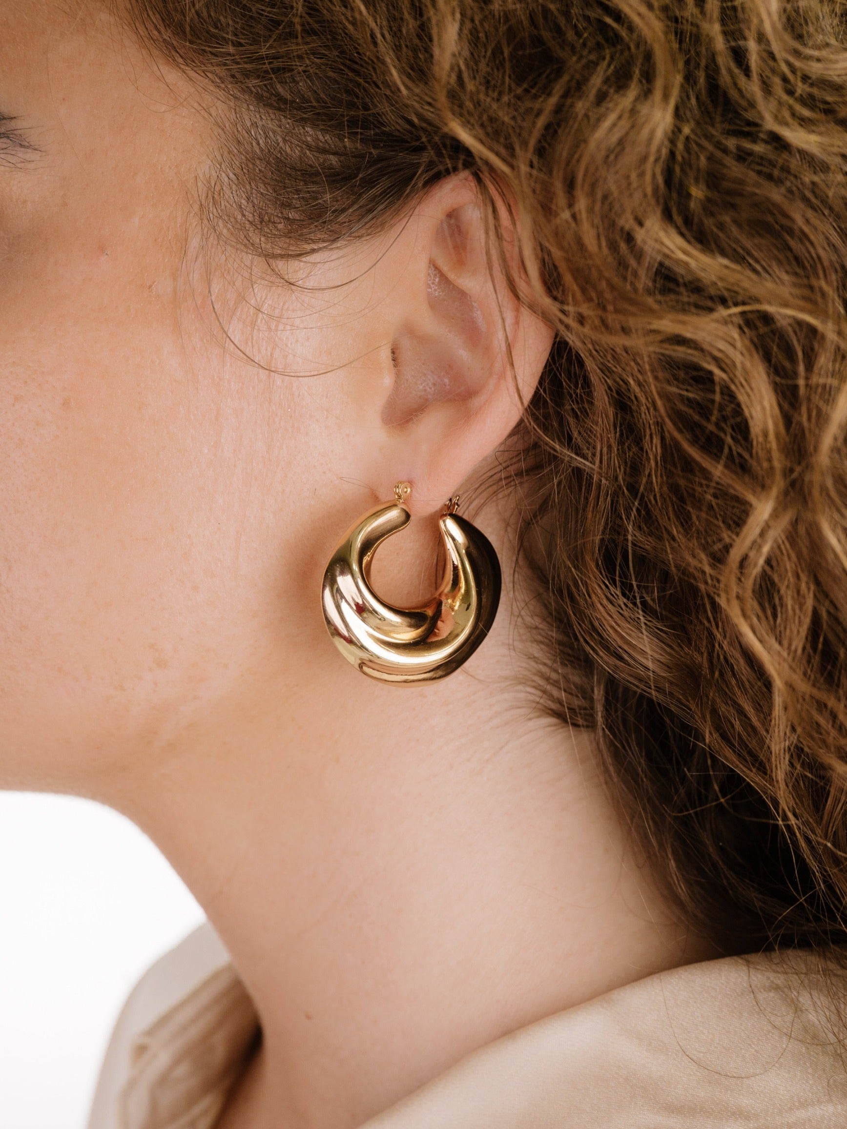 Crescent Swirl Hoop Earrings on model