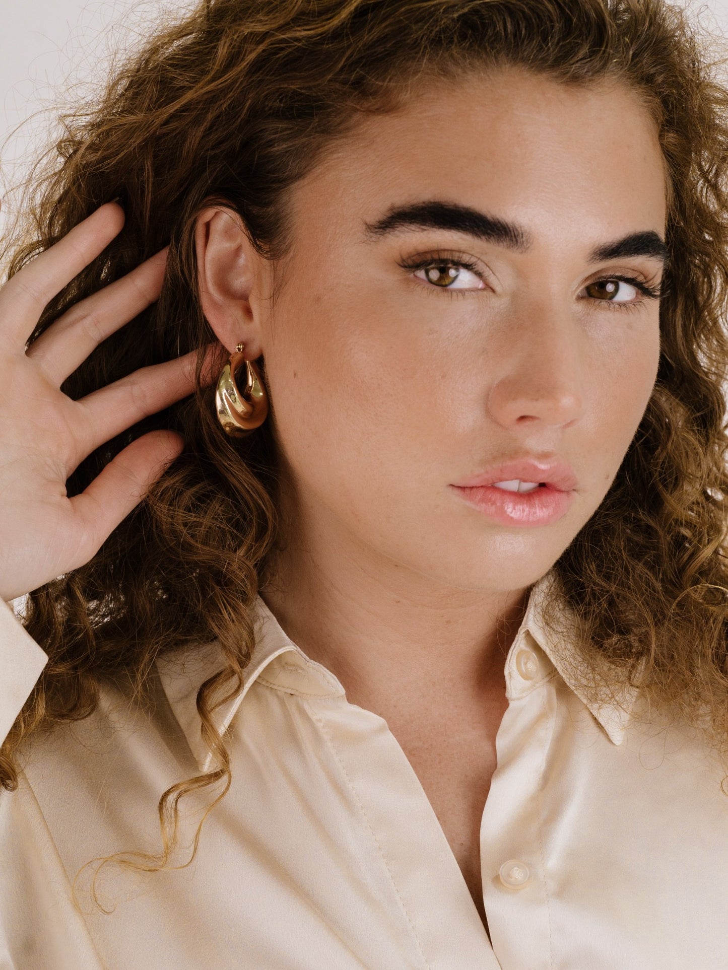 Crescent Swirl Hoop Earrings on model 2