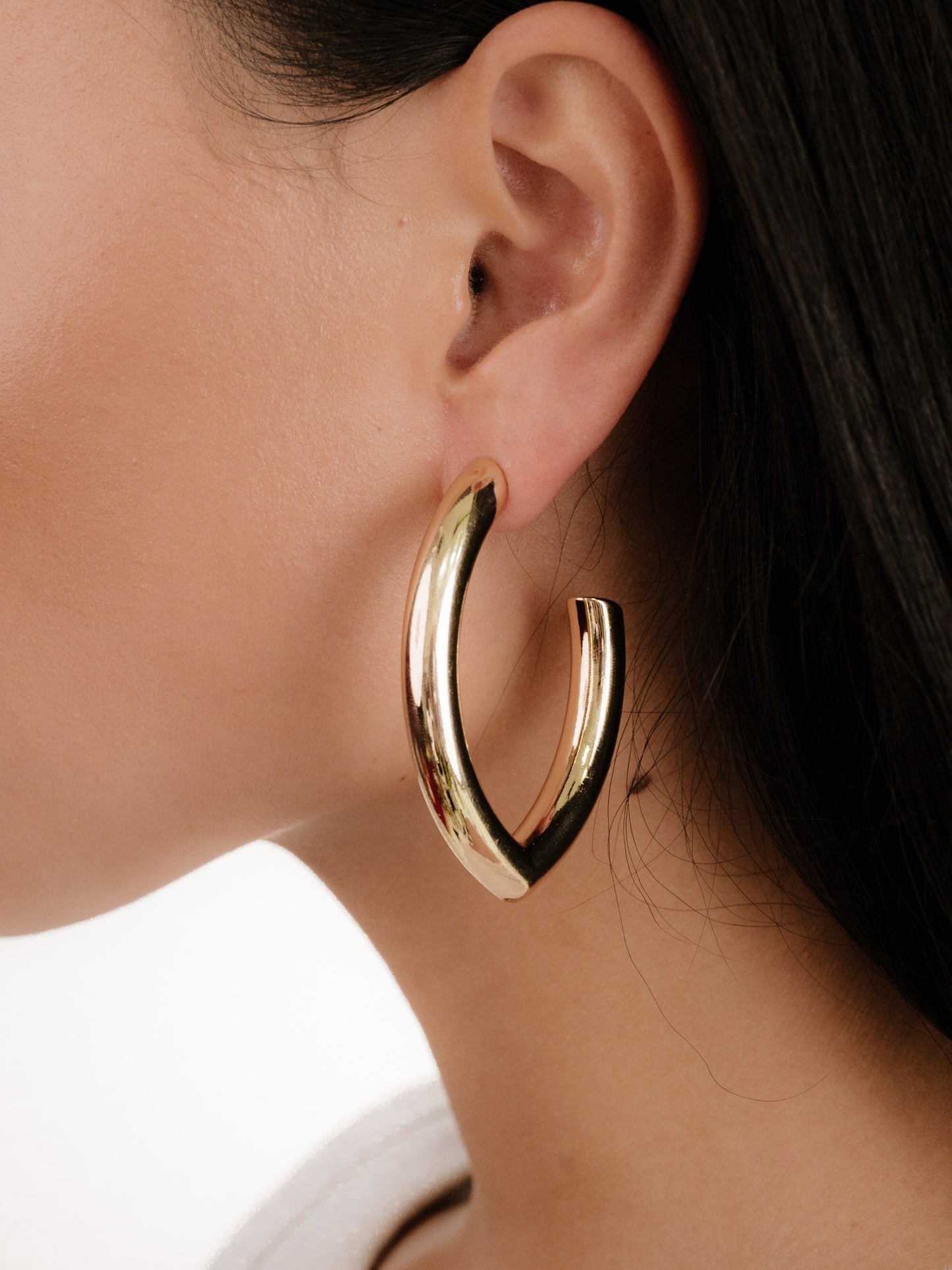 Mara Elongated Hoop Earrings on model