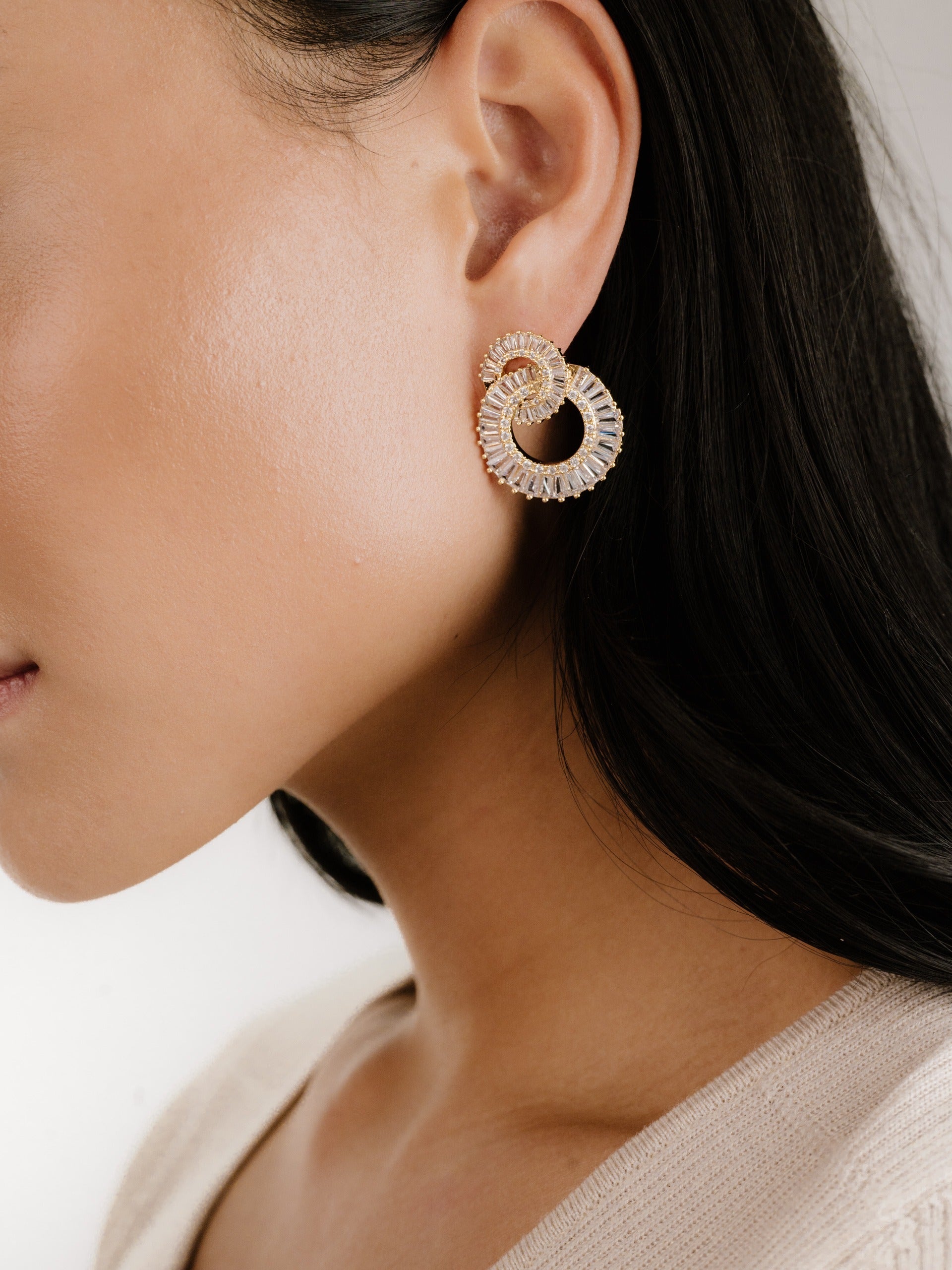 Rotating Circles Crystal Earrings on model