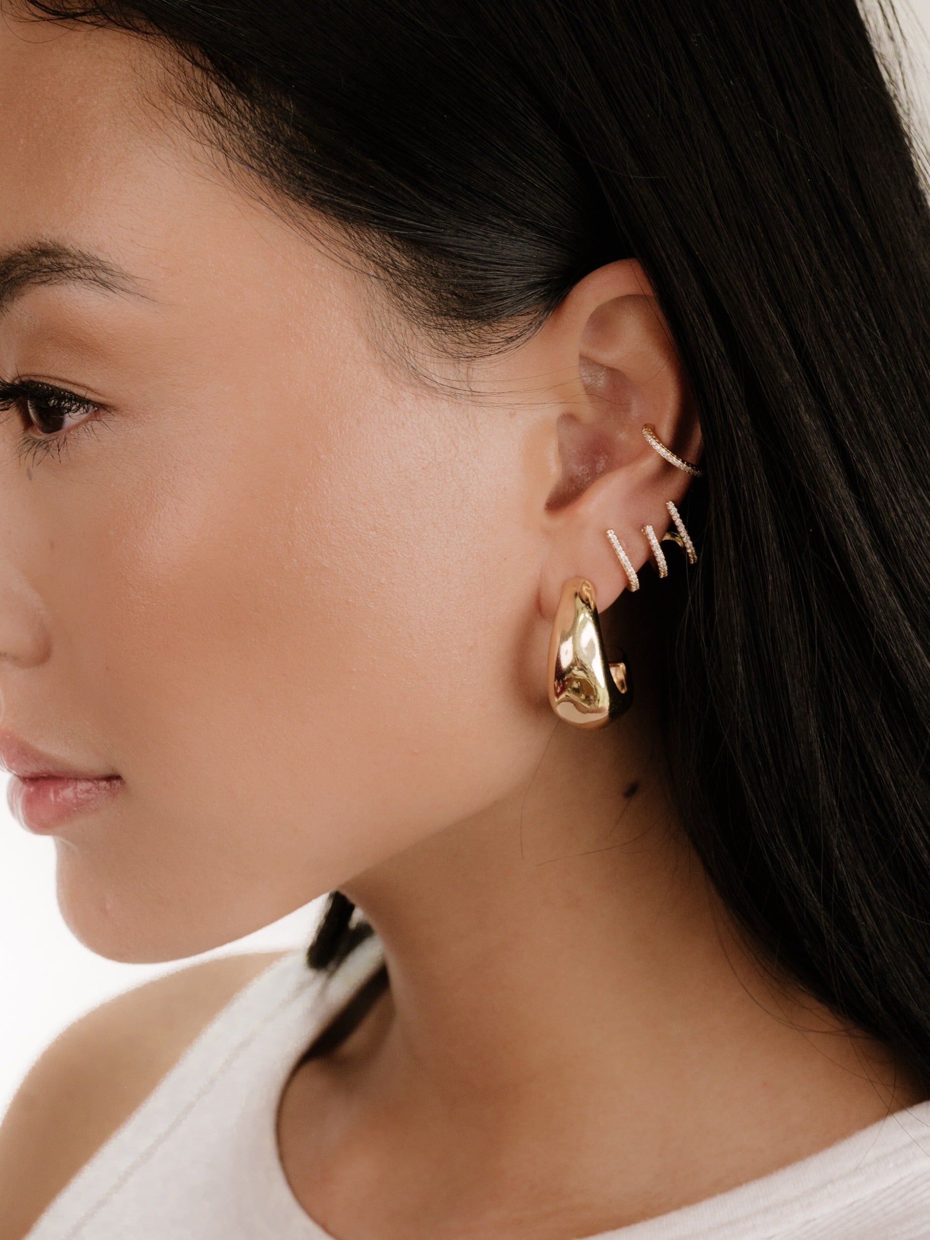True Golden Hoop Earrings on model 5