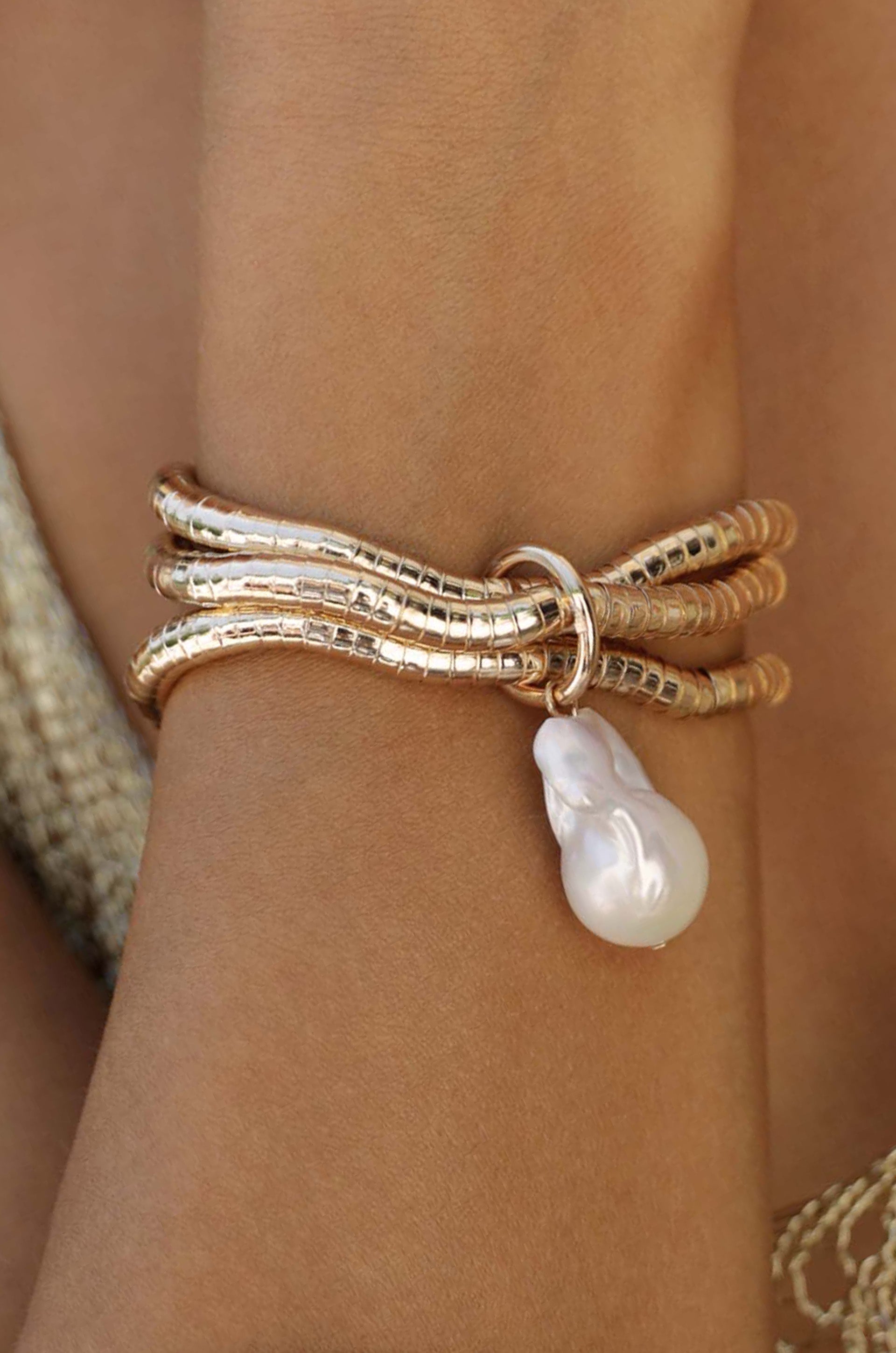 Liquid Gold and Pearl Multi Layered Bracelet on model