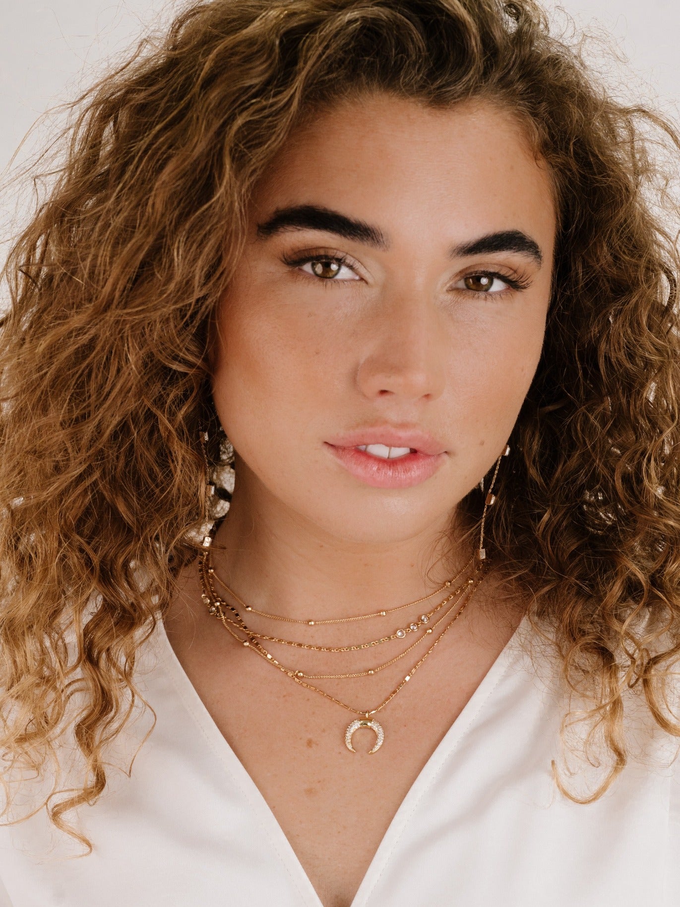 Layered Gold Chain & Crescent Horn Necklace on model 3