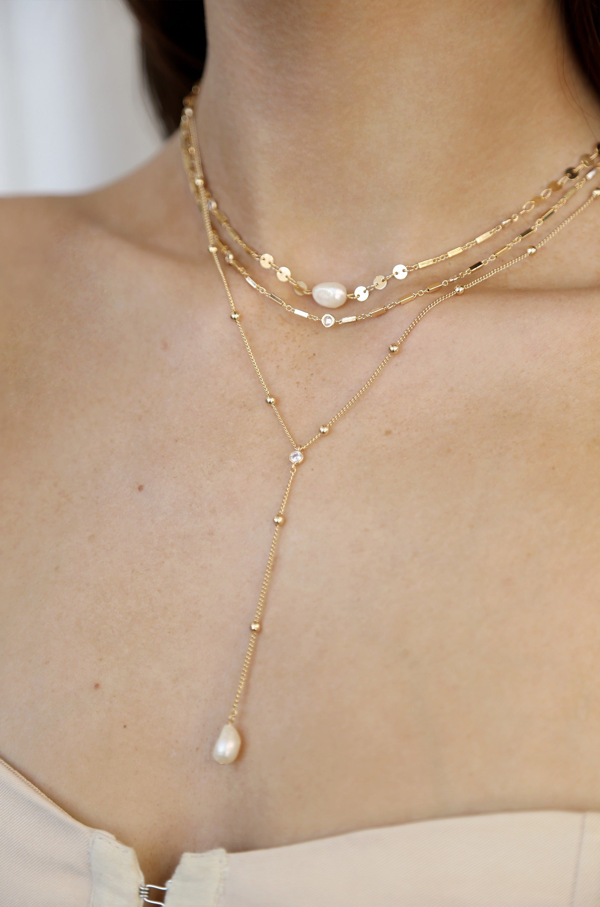Forever Falling Pearl Multi-Chain Lariat Choker on model 2