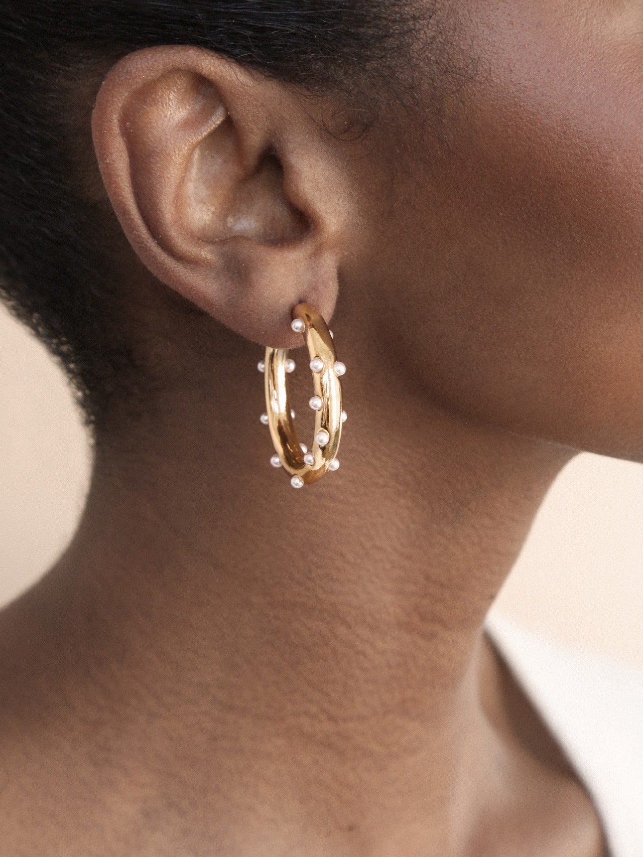 Spotted Pearl Hoop Earrings on model
