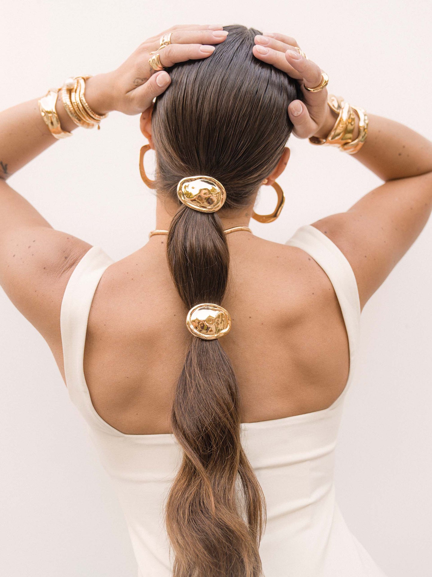 Liquid Luxe Hair Tie Gold Tone with Black Elastic model 2