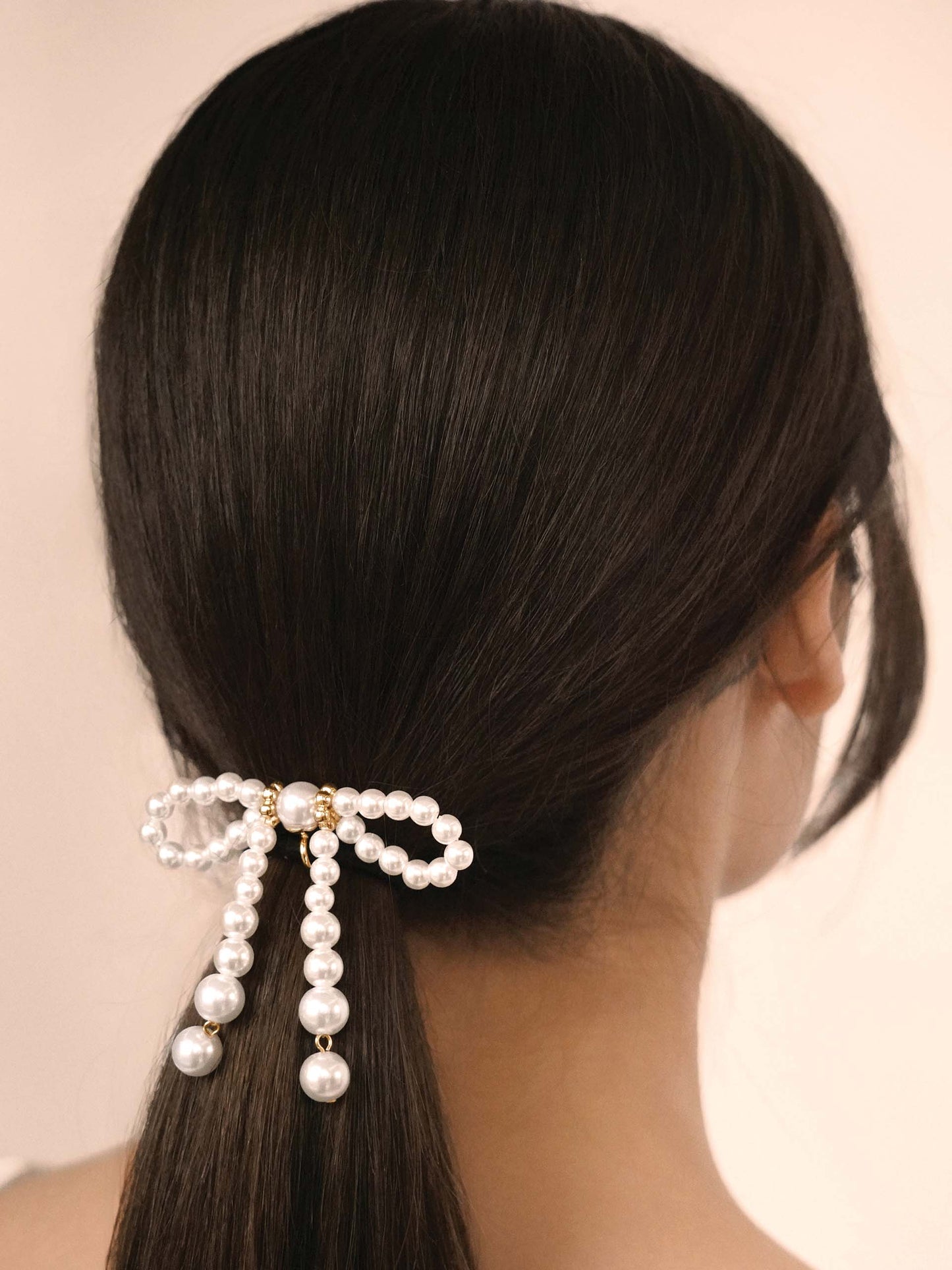 Aurora Pearl Bow Hair Tie Gold Tone with Black Elastic model 2
