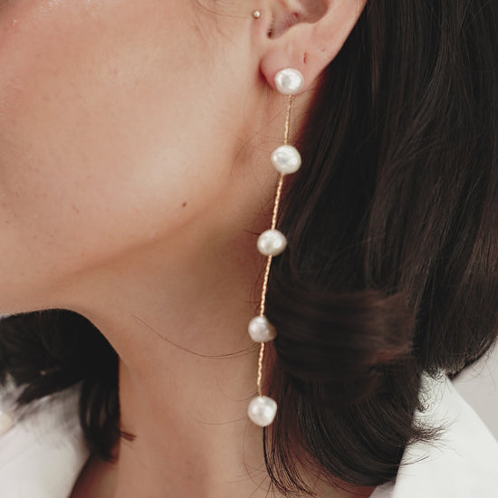 Dripping Pearl Delicate Drop Earrings on model  in video