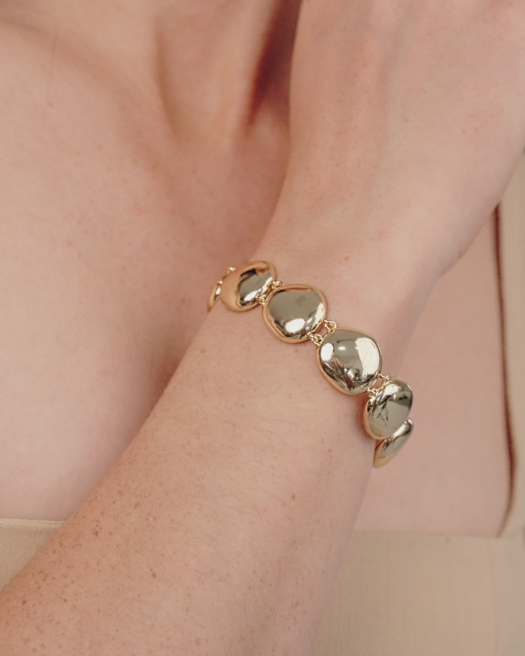 Polished Pebble Linked Bracelet in gold in video