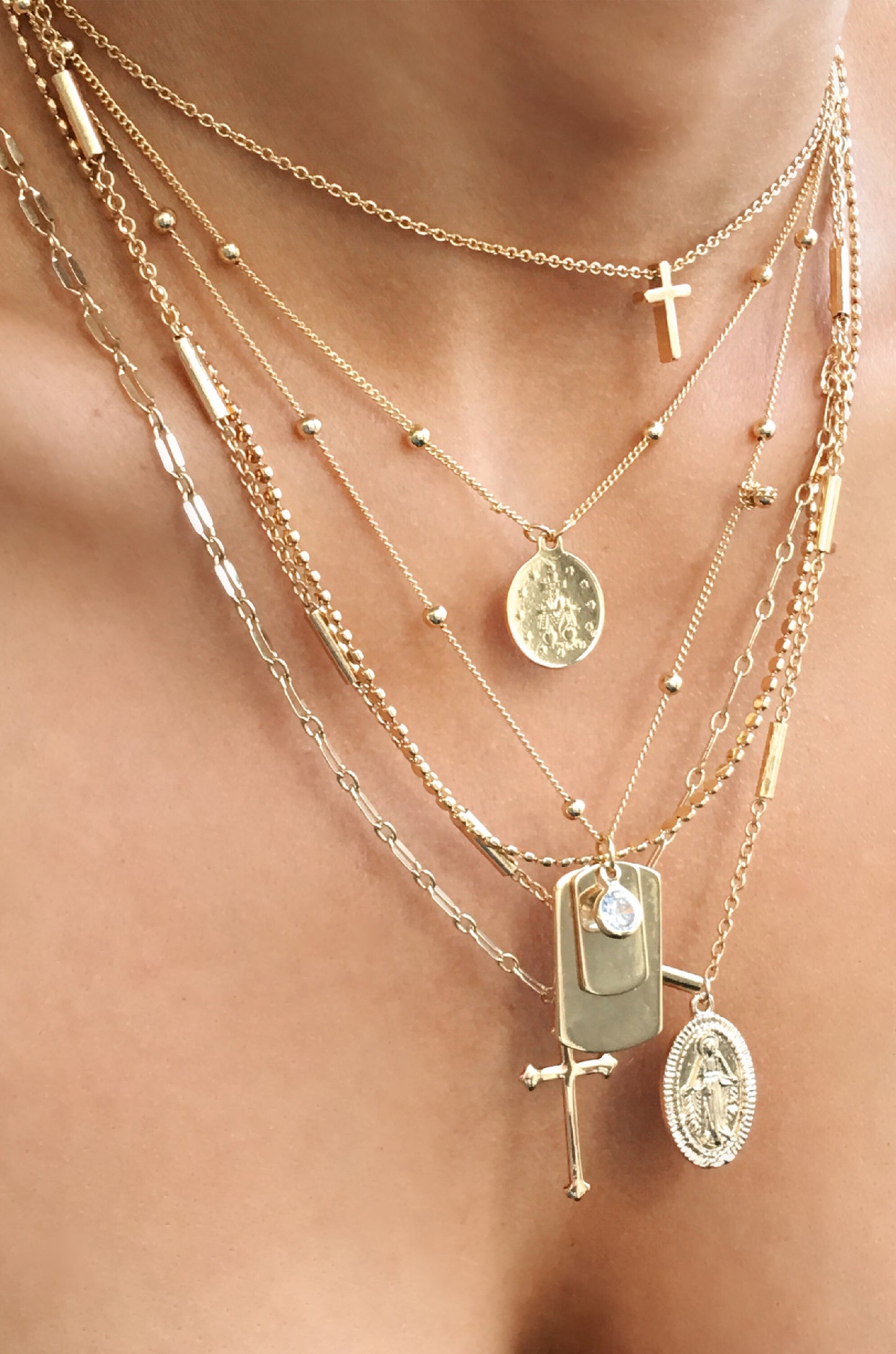 Like a Prayer Layered Cross and Coin Necklace shown on a model