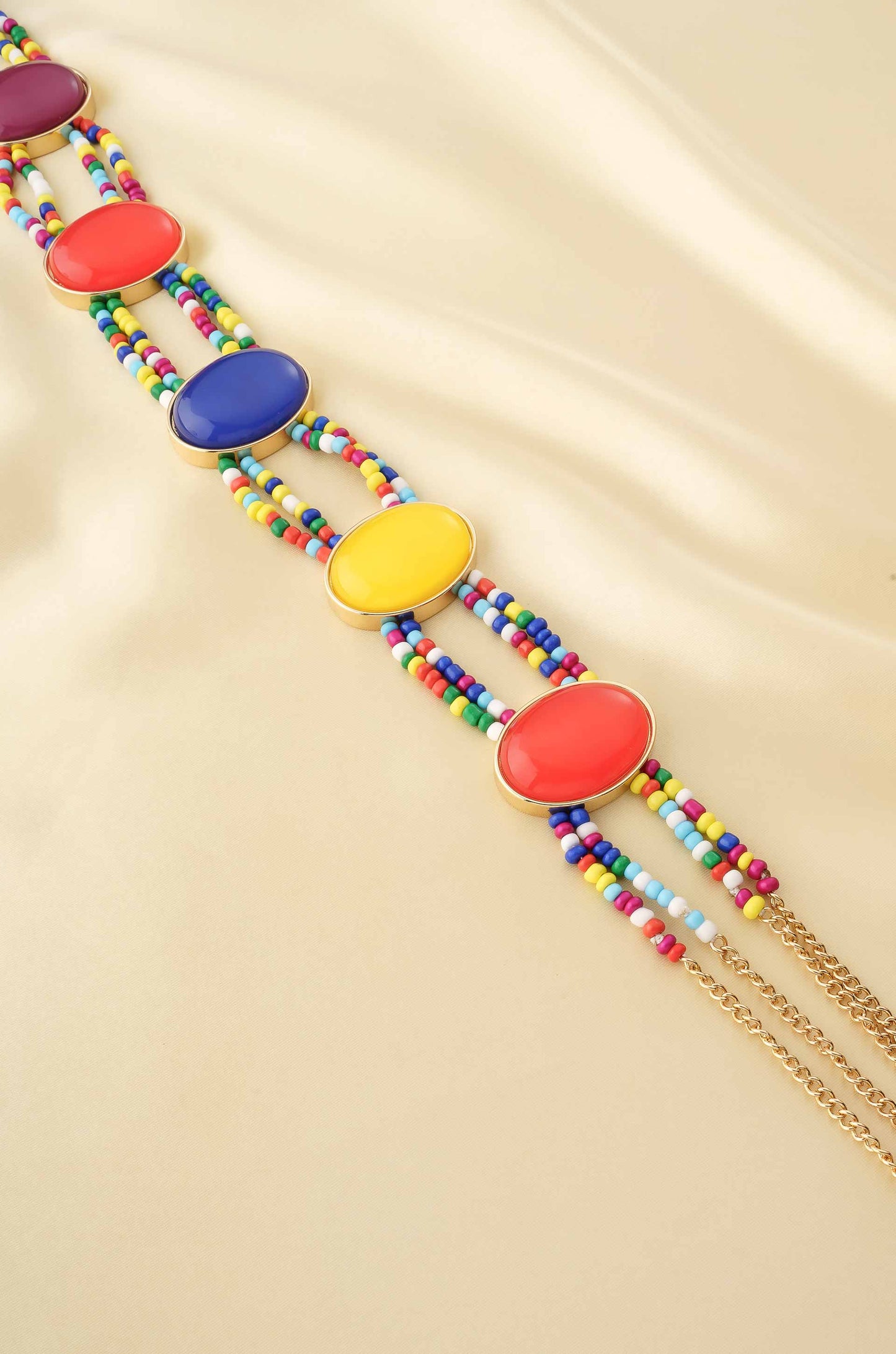 Mixed Rainbow Bead Belt in Gold on satin background