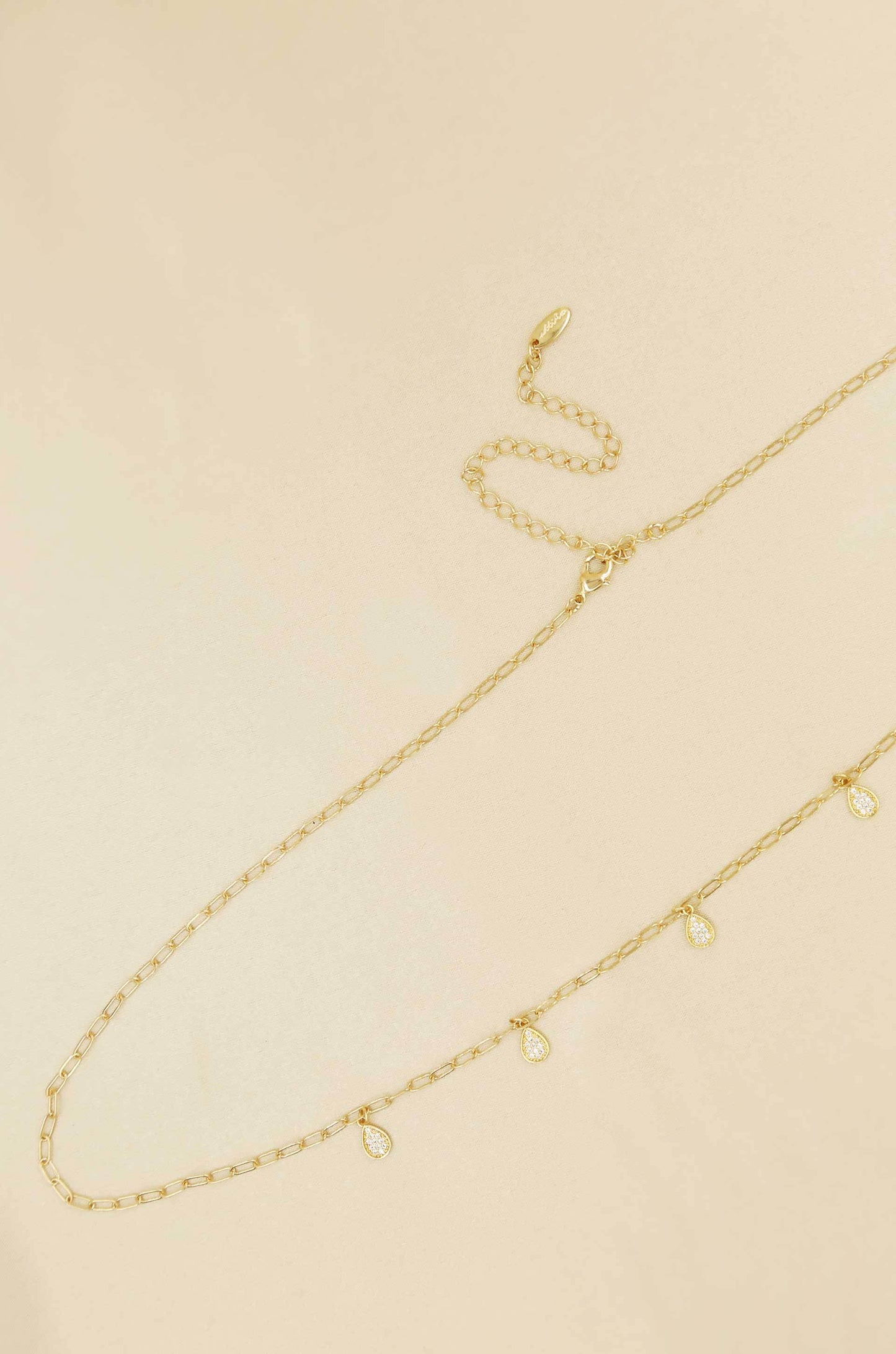 Delicate Crystal Droplet Gold Body Chain on slate background
