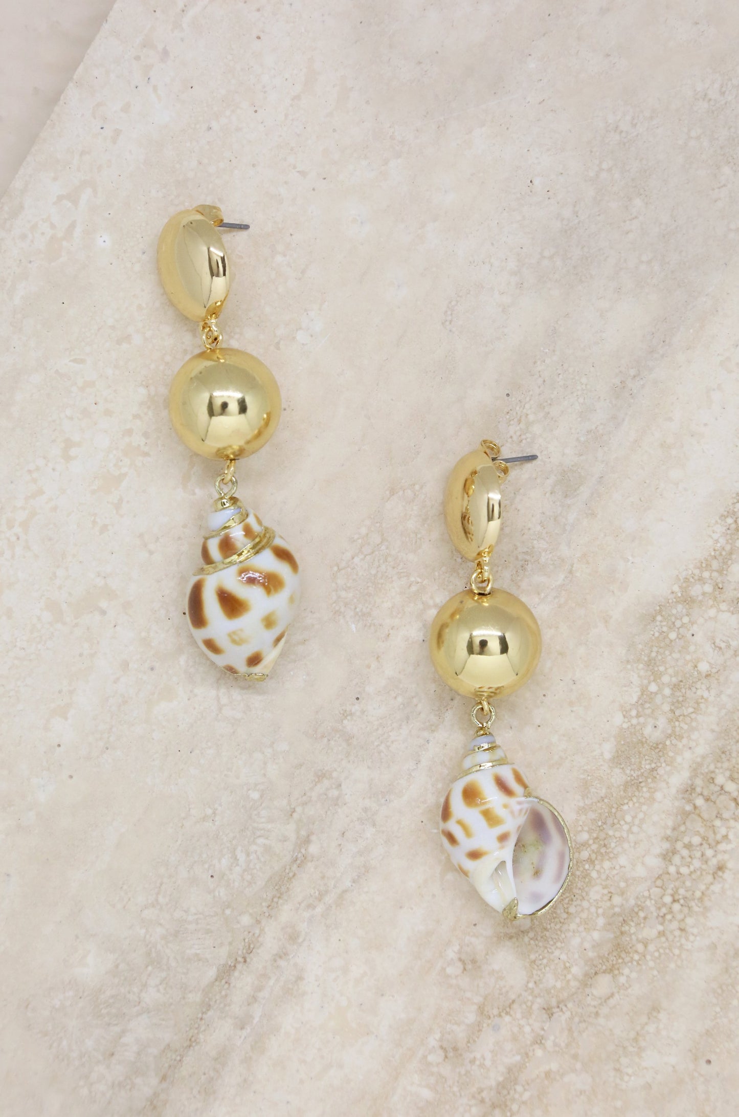 Conch Shell 18k Gold Plated Drop Earrings on slate background