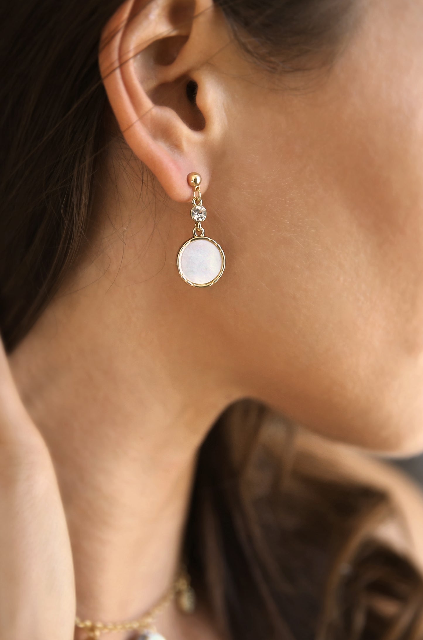 Love by the Moon White Drop 18k Gold Plated Earrings shown on a model