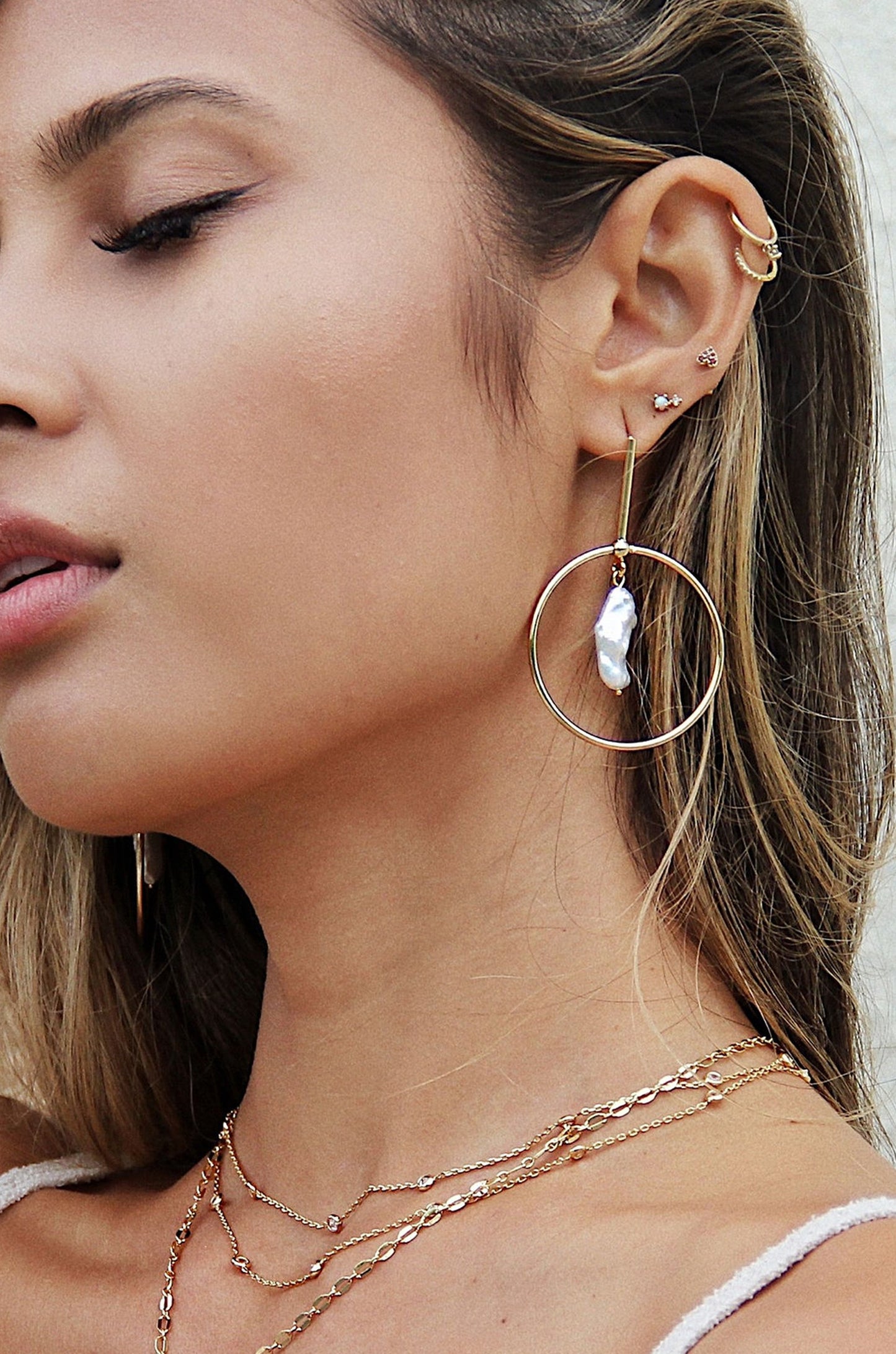 Modern 18k Gold Plated & Freshwater Pearl Drop Hoop Earrings shown on a model