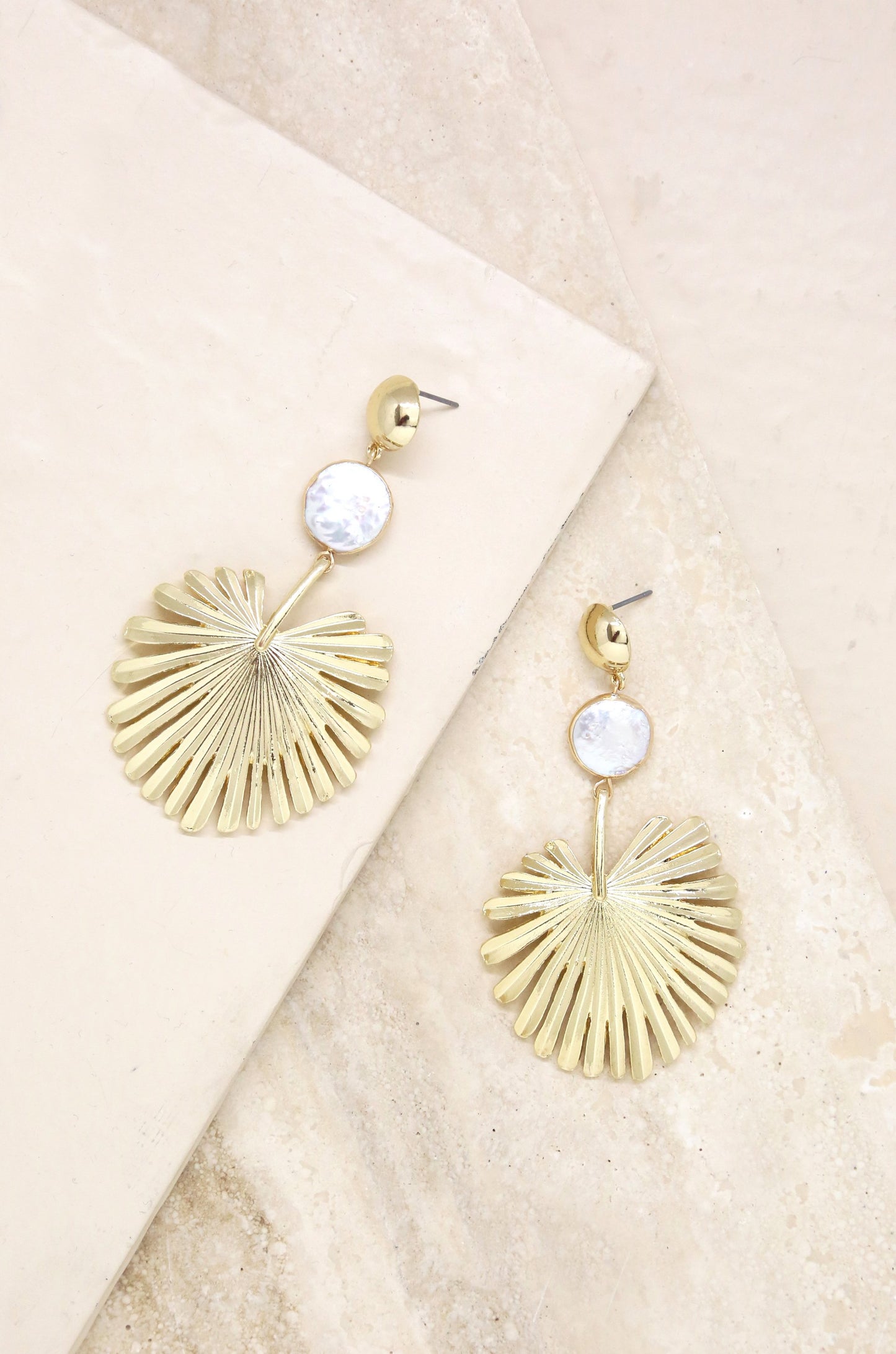 Palm Leaf Earring with Pearl in Gold on slate background