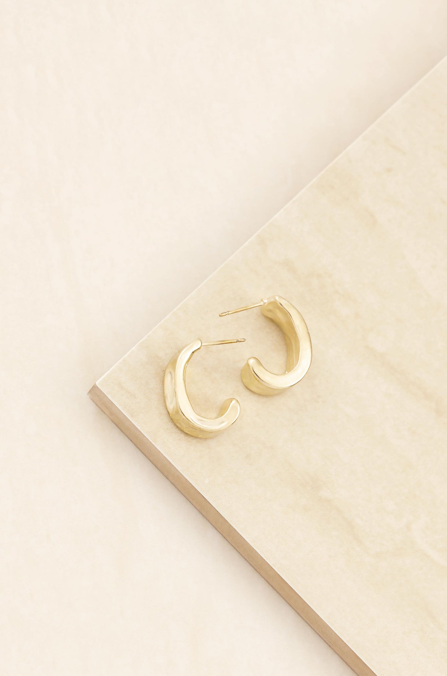 Miss Modern Mini 18k Gold Plated Half Hoops on slate background
