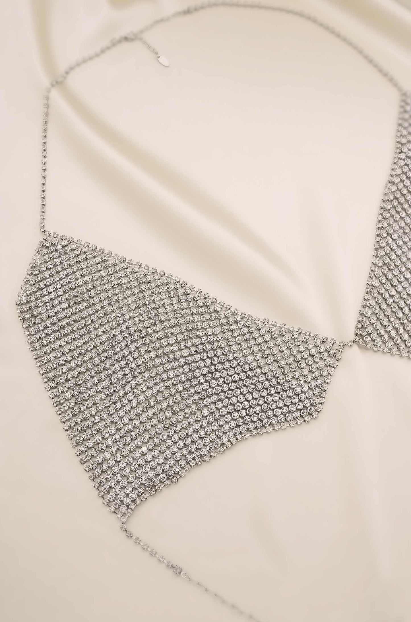 Limelight Crystal and Rhodium Bikini Top Body Chain on satin