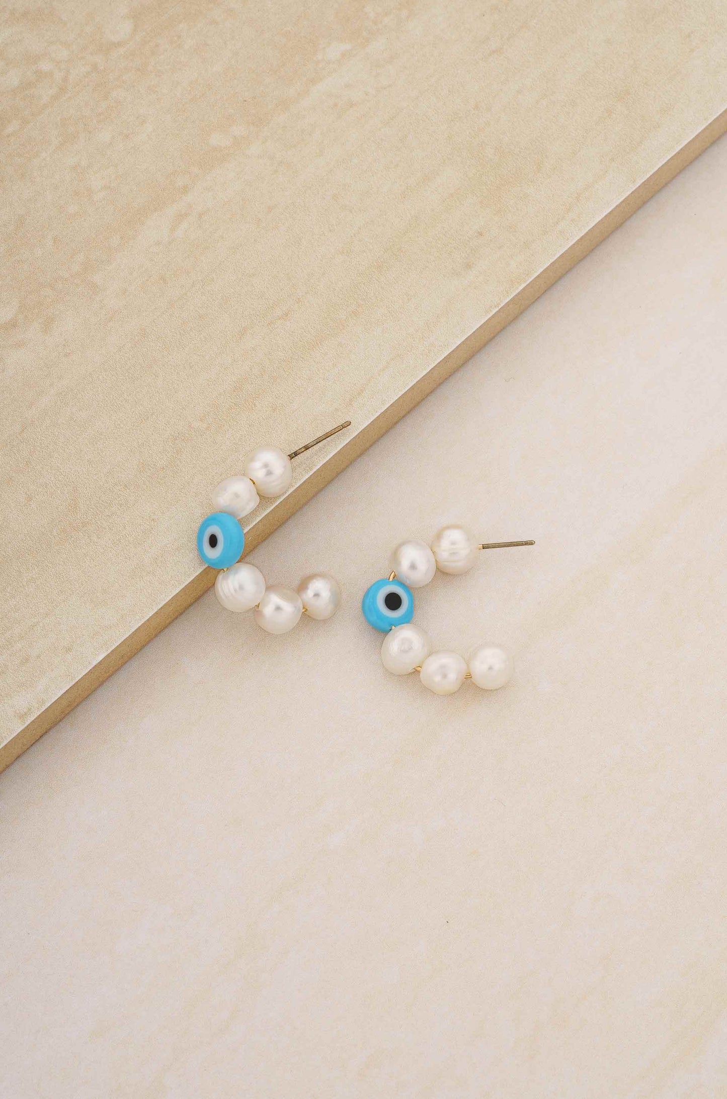 Evil Eye and Pearl Hoop 18k Gold Plated Earrings ON SLATE