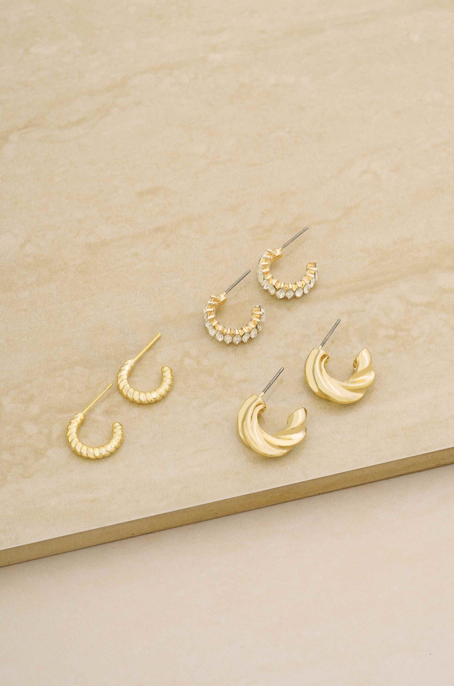 Tiny and Shiny 18kt Gold Plated Huggie Hoop Earring Set on slate