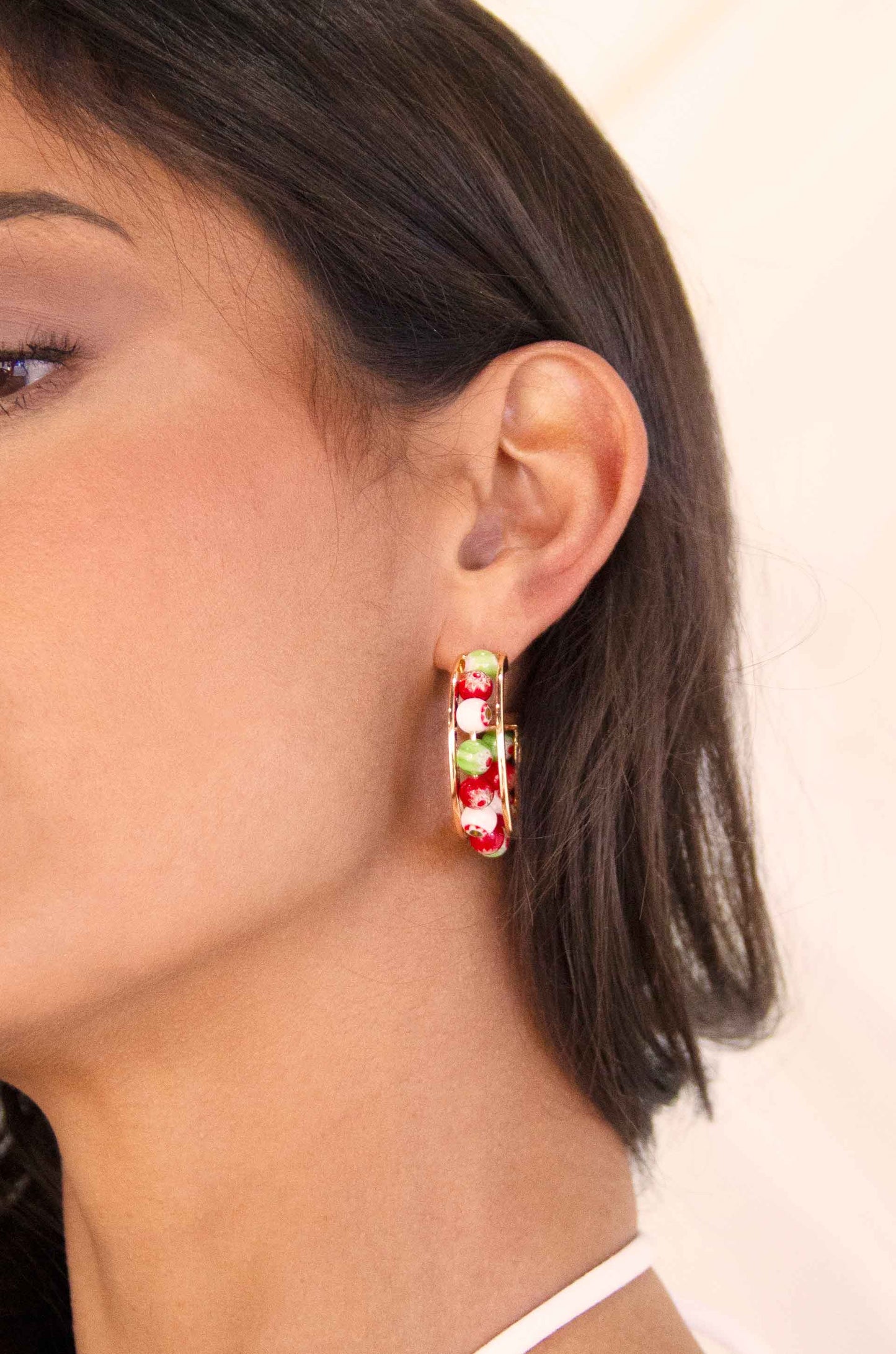 Merry and Bright Bead 18k Gold Plated Hoop Earrings on a model