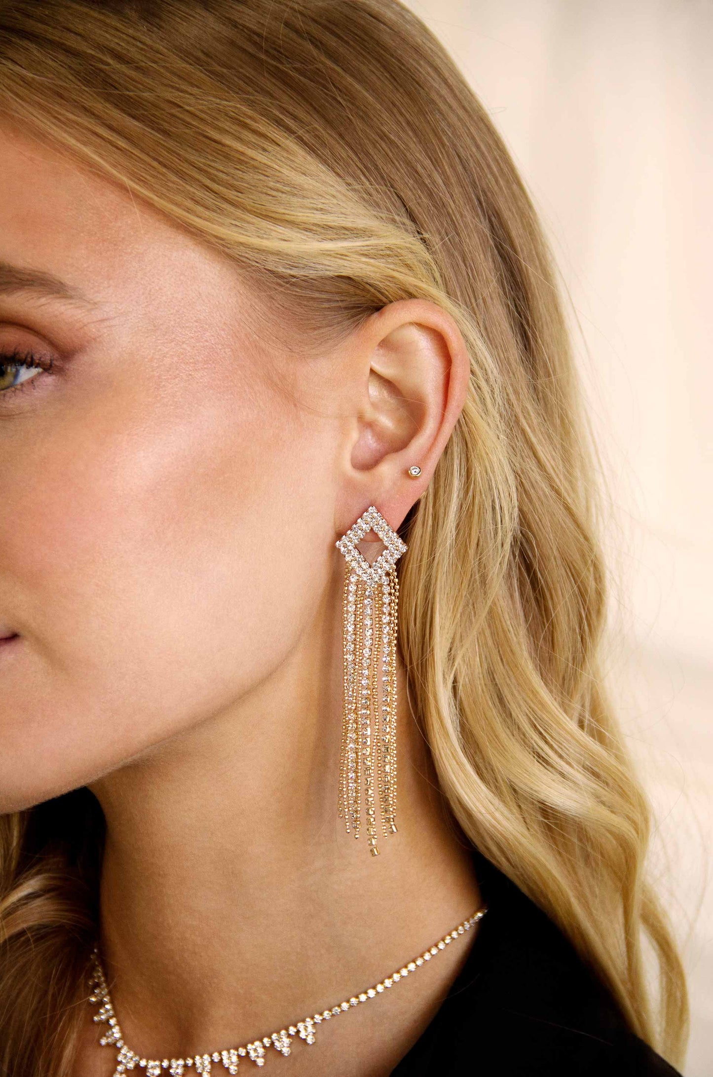 Only Elegance Crystal Chain 18k Gold Plated Dangle Earring on a model