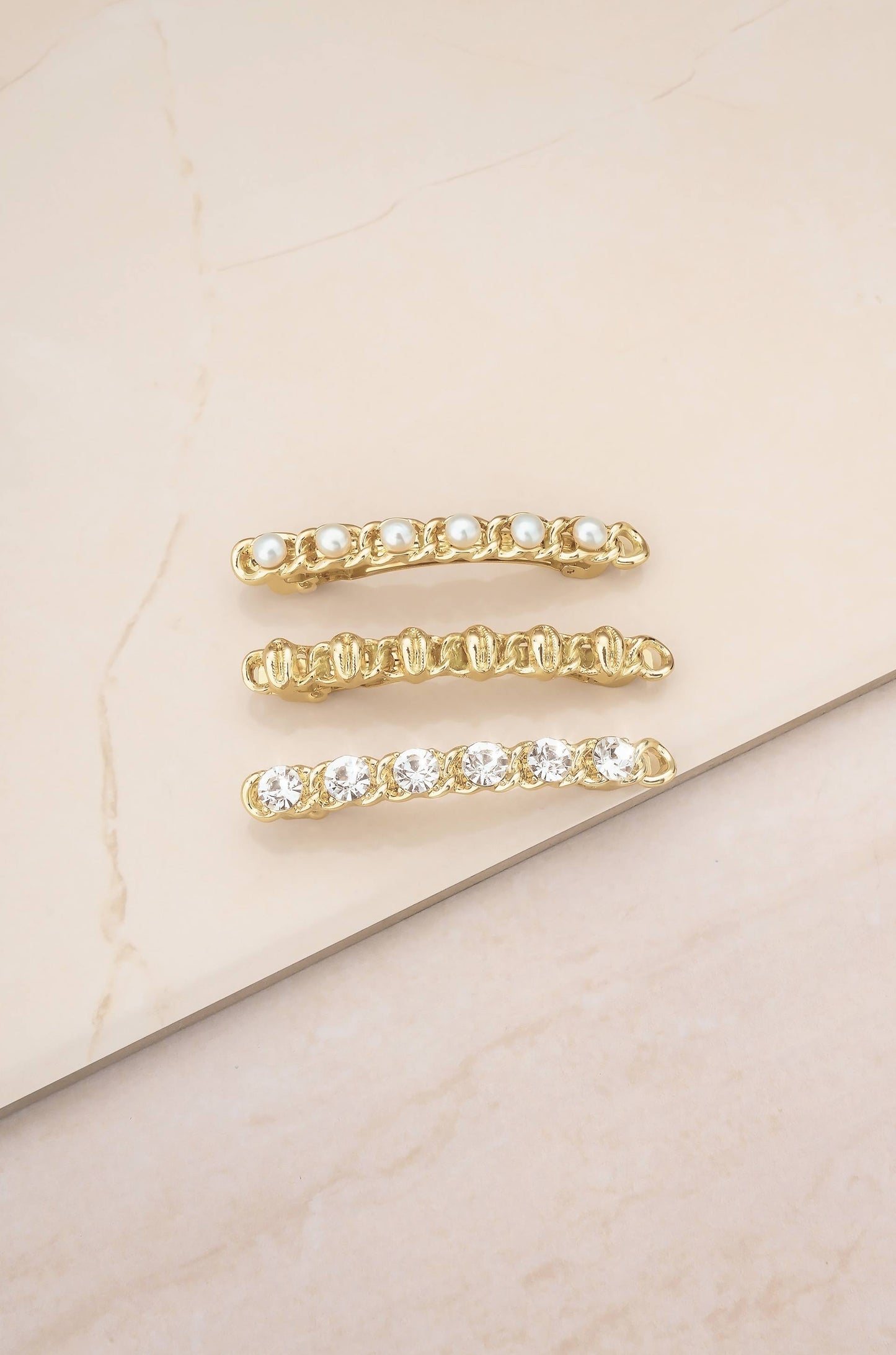 Gold Cowrie and Pearl Clip Set on slate