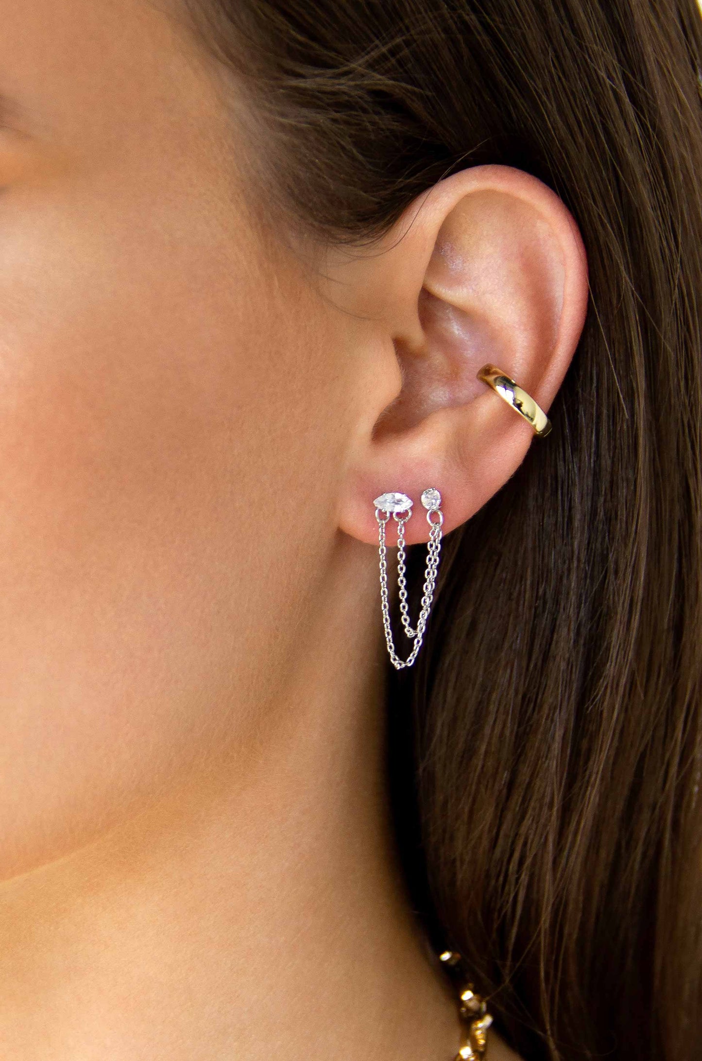 Double Piercing Chain Dangle Earrings in rhodium on a model